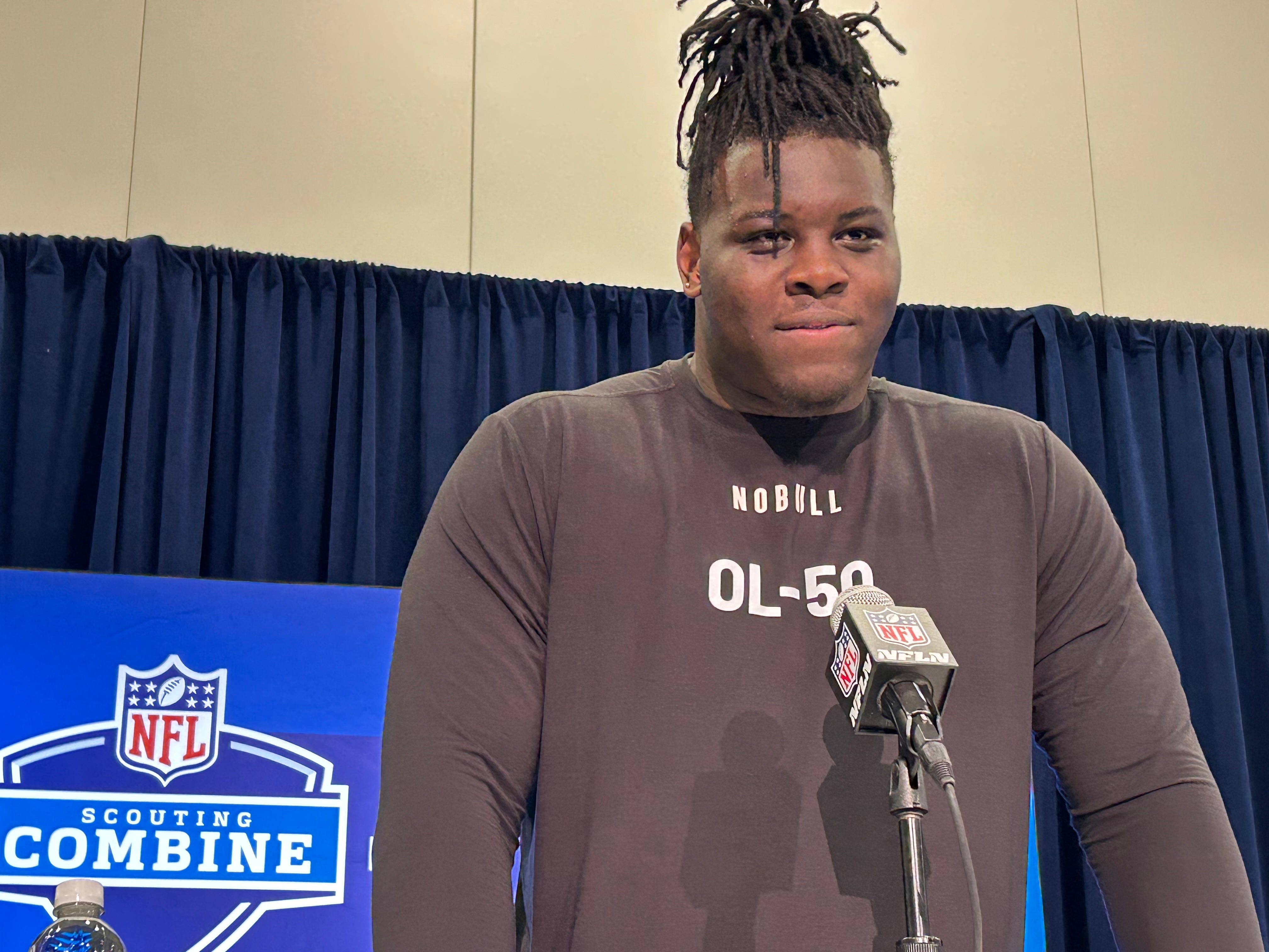 Former Georgia football offensive tackle Amarius Mims speaks to reporters on March 2, 2024 at the NFL combine in Indianapolis.