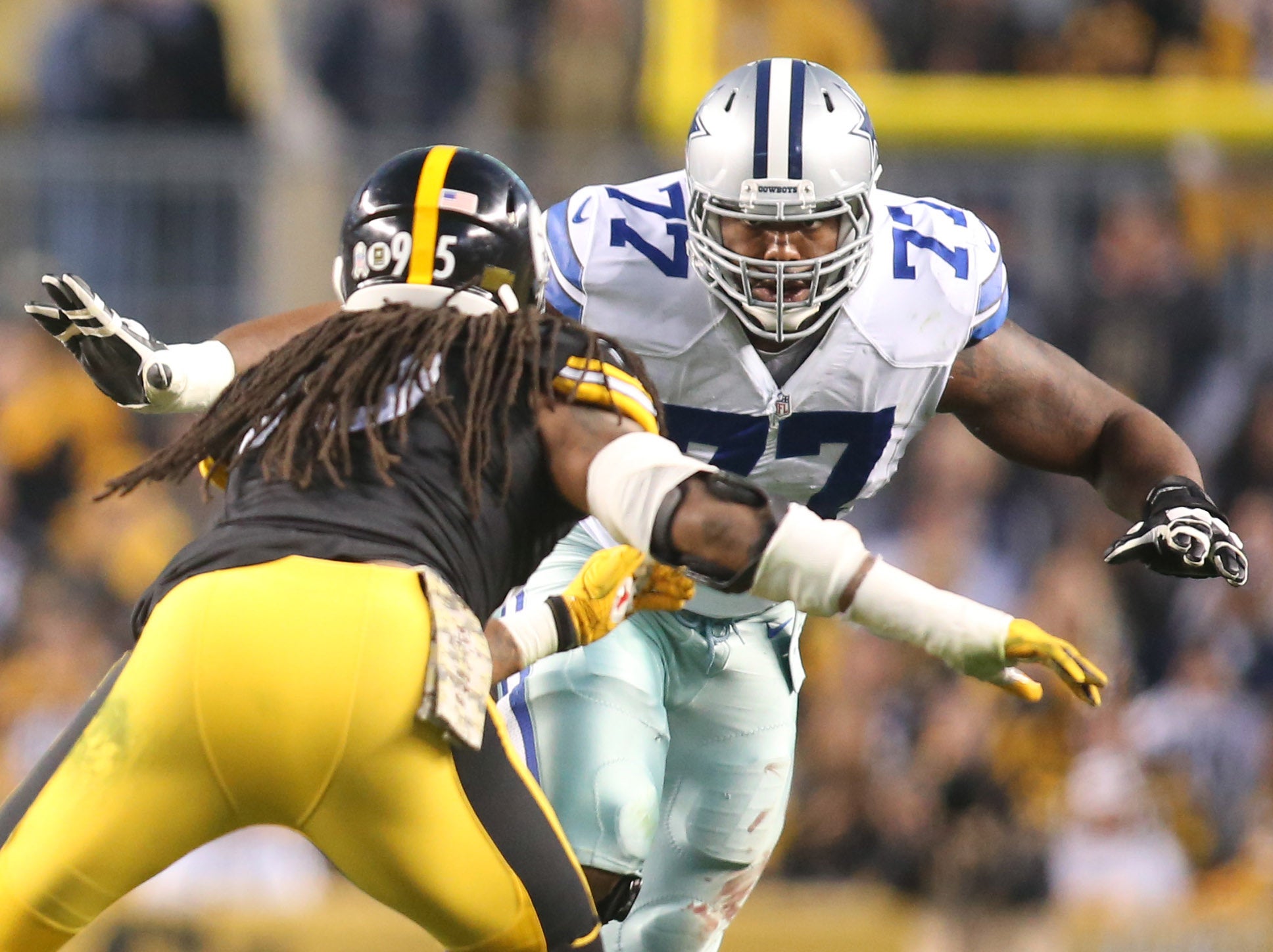 Nov 13, 2016; Pittsburgh, PA, USA; Dallas Cowboys tackle Tyron Smith (77) blocks at the line of scrimmage against Pittsburgh Steelers outside linebacker Jarvis Jones (95) during the first quarter at Heinz Field. The Cowboys won 35-30. Mandatory Credit: Charles LeClaire-USA TODAY Sports  
