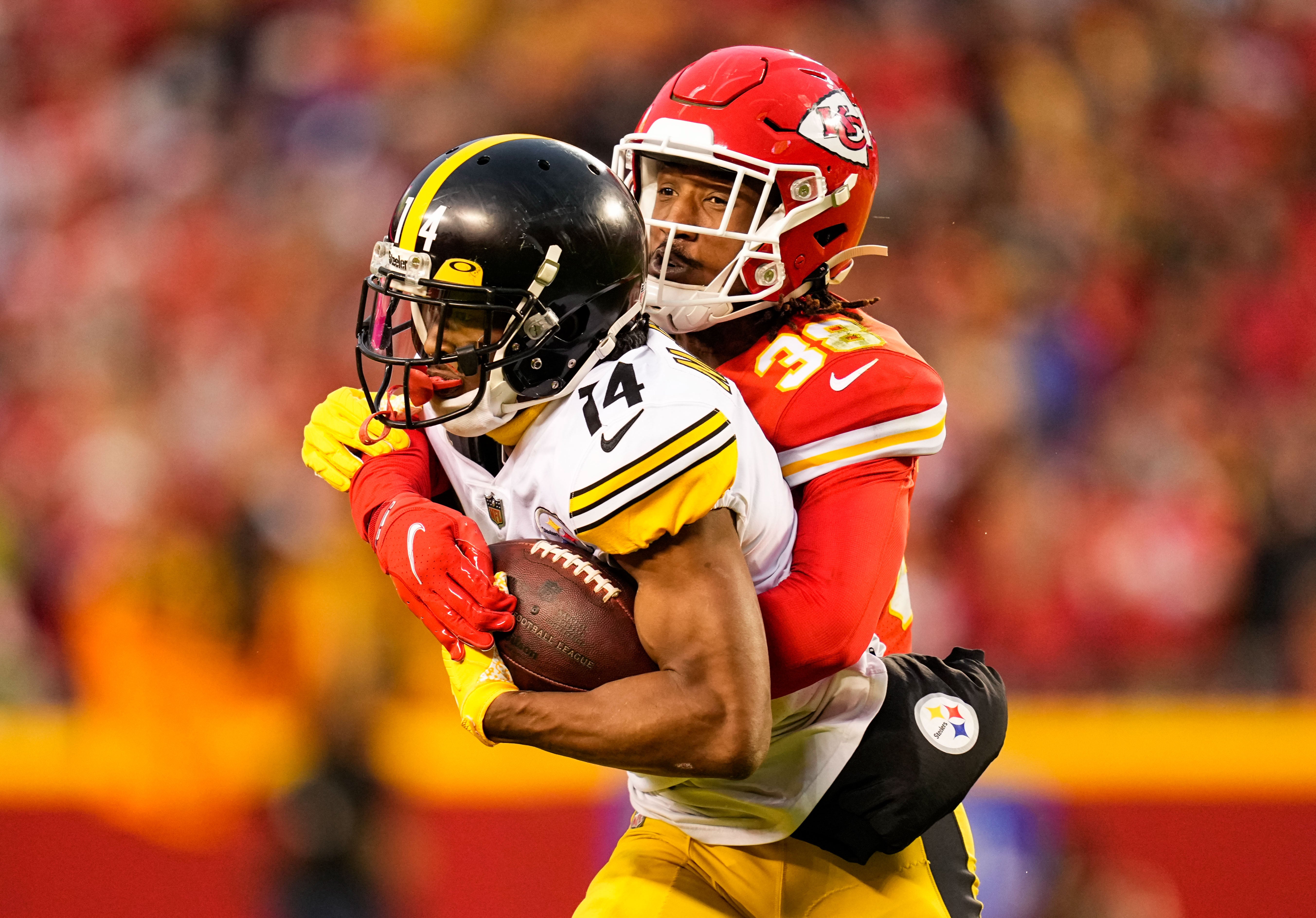 Dec 26, 2021; Kansas City, Missouri, USA; Pittsburgh Steelers wide receiver Ray-Ray McCloud (14) is tackled by Kansas City Chiefs cornerback L'Jarius Sneed (38) during the first half at GEHA Field at Arrowhead Stadium. Mandatory Credit: Jay Biggerstaff-USA TODAY Sports