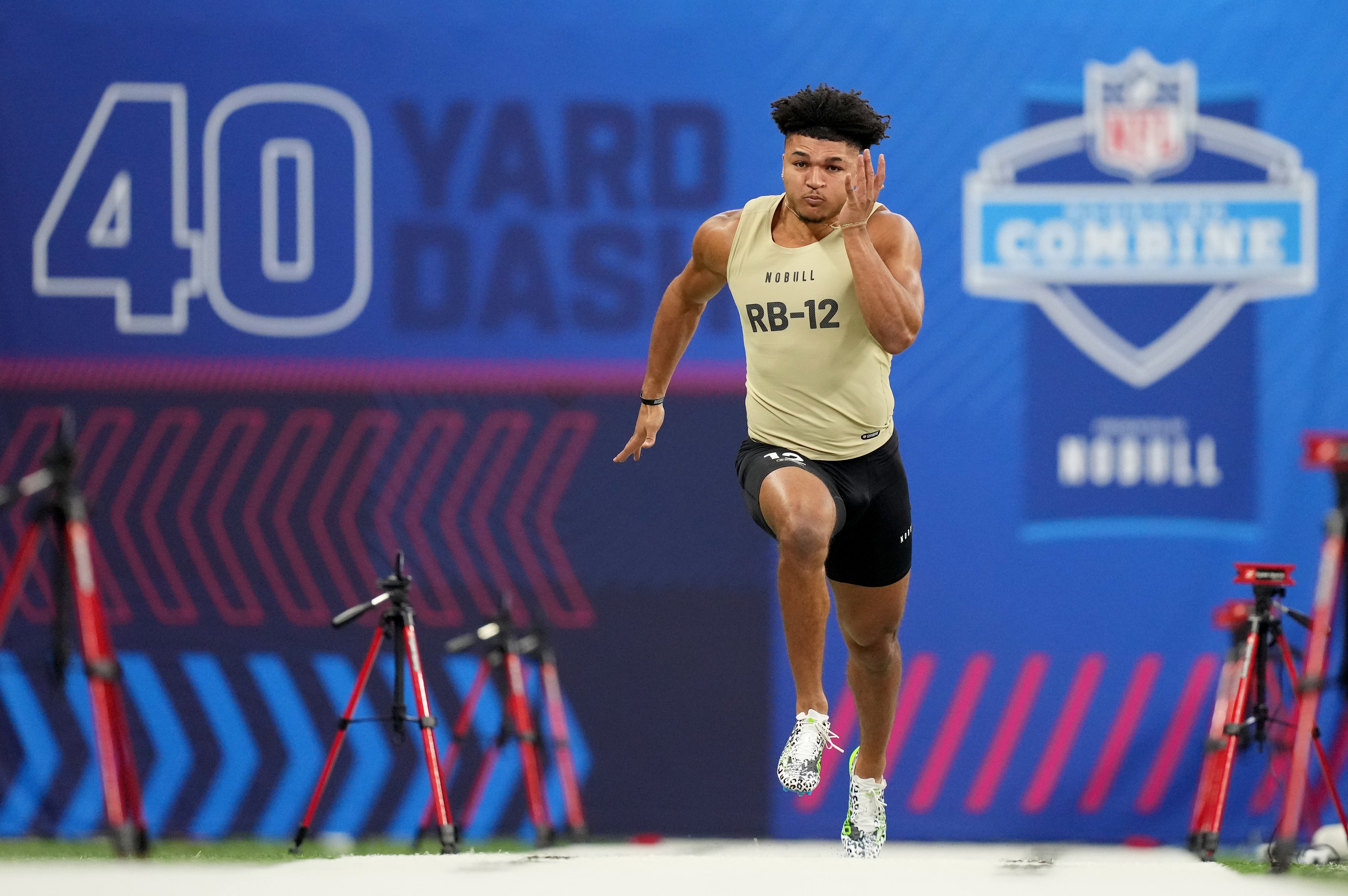 Mar 2, 2024; Indianapolis, IN, USA; Louisville running back Isaac Guerendo (RB12) during the 2024 NFL Combine at Lucas Oil Stadium.