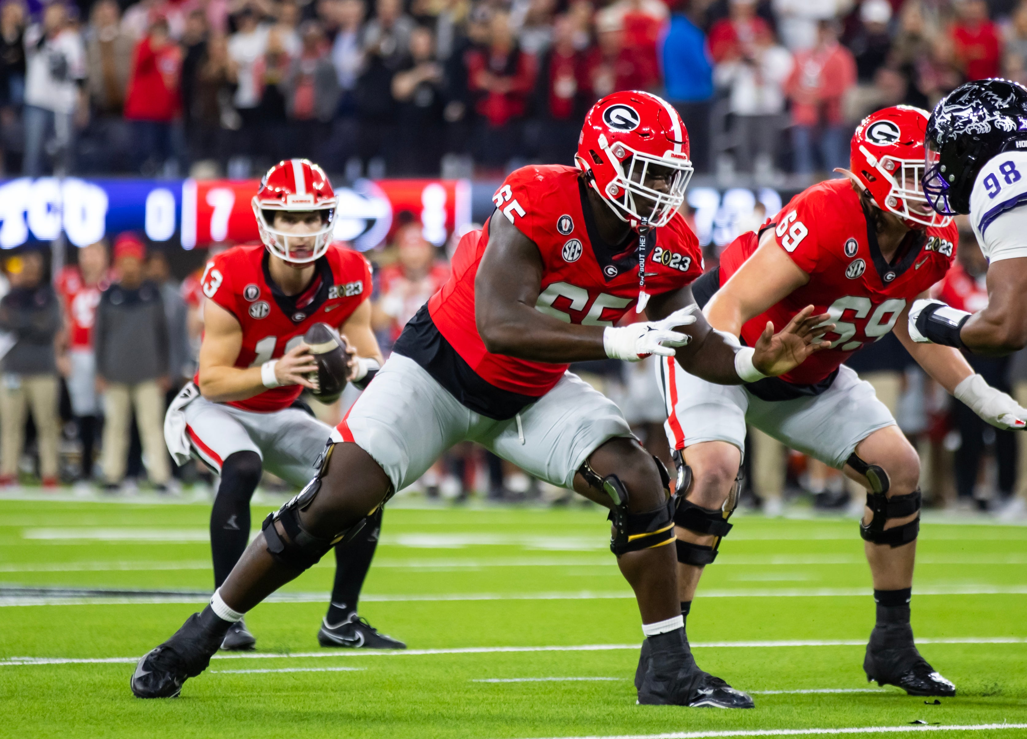 Jan 9, 2023; Inglewood, CA, USA; Georgia Bulldogs offensive lineman Amarius Mims (65) against the TCU Horned Frogs during the CFP national championship game at SoFi Stadium.