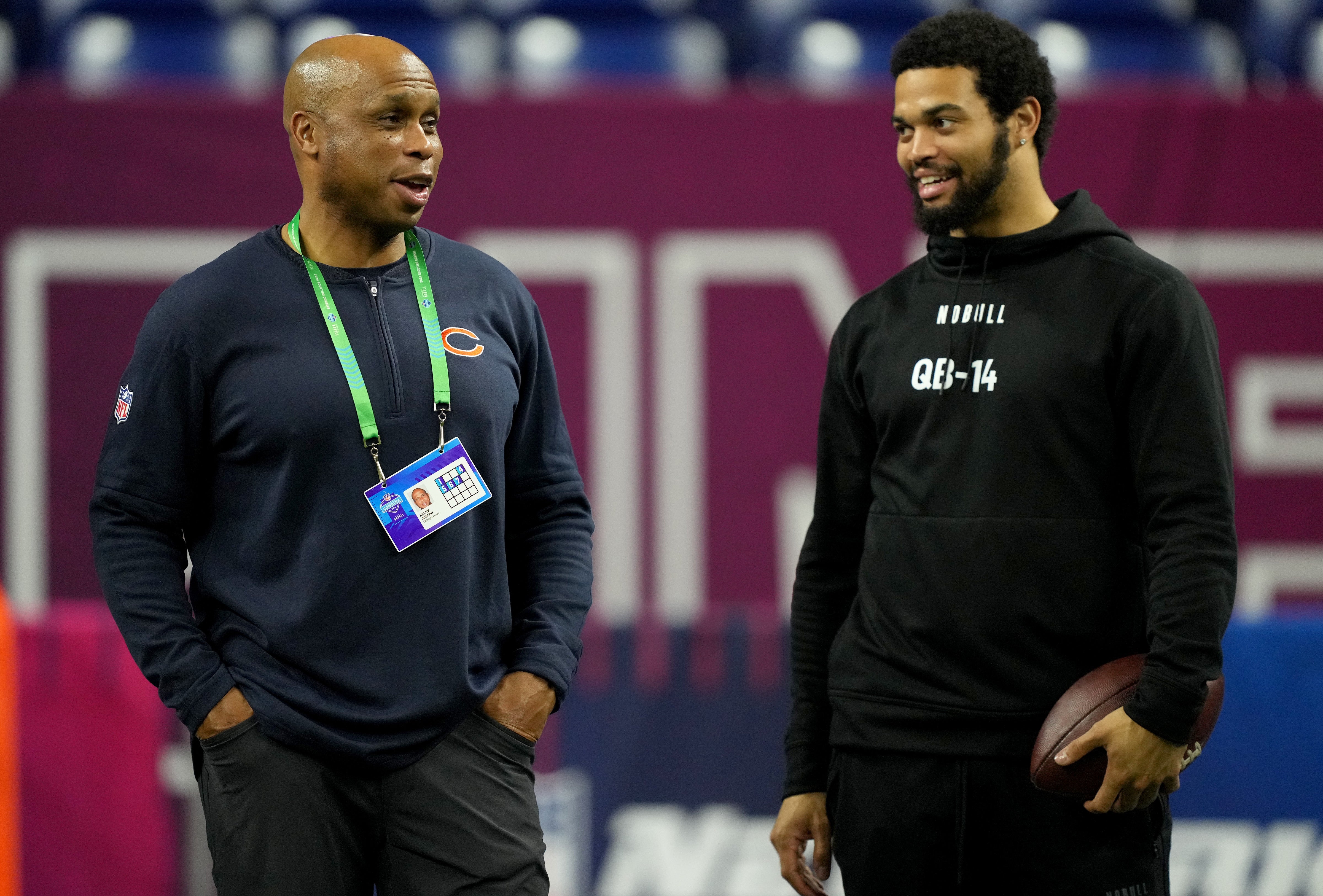 Mar 2, 2024; Indianapolis, IN, USA; Chicago Bears quarterbacks coach Kerry Joseph talks to Southern California quarterback Caleb Williams (QB14) during the 2024 NFL Combine at Lucas Oil Stadium.