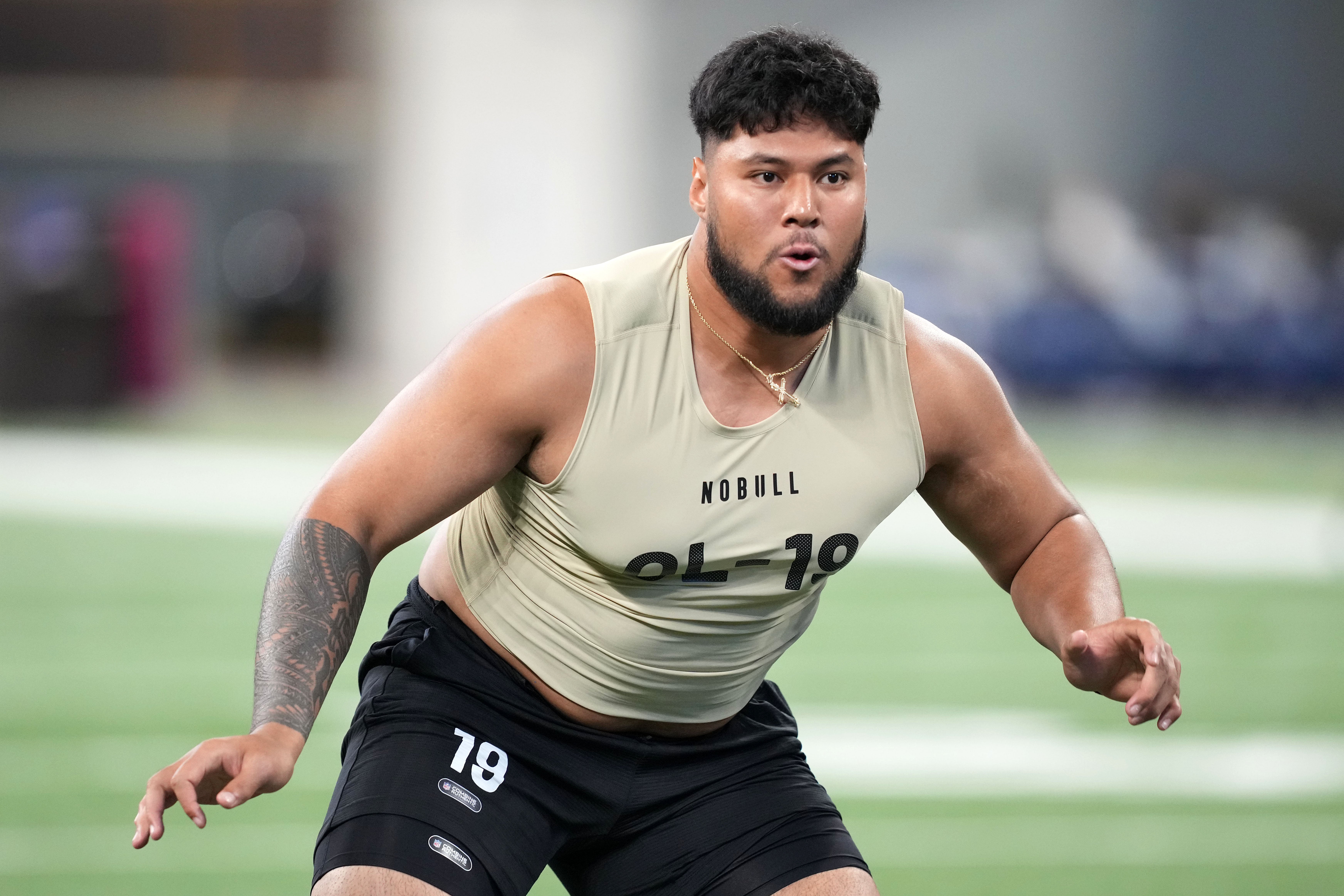Mar 3, 2024; Indianapolis, IN, USA; Washington offensive lineman Troy Fautanu (OL19) during the 2024 NFL Combine at Lucas Oil Stadium. 