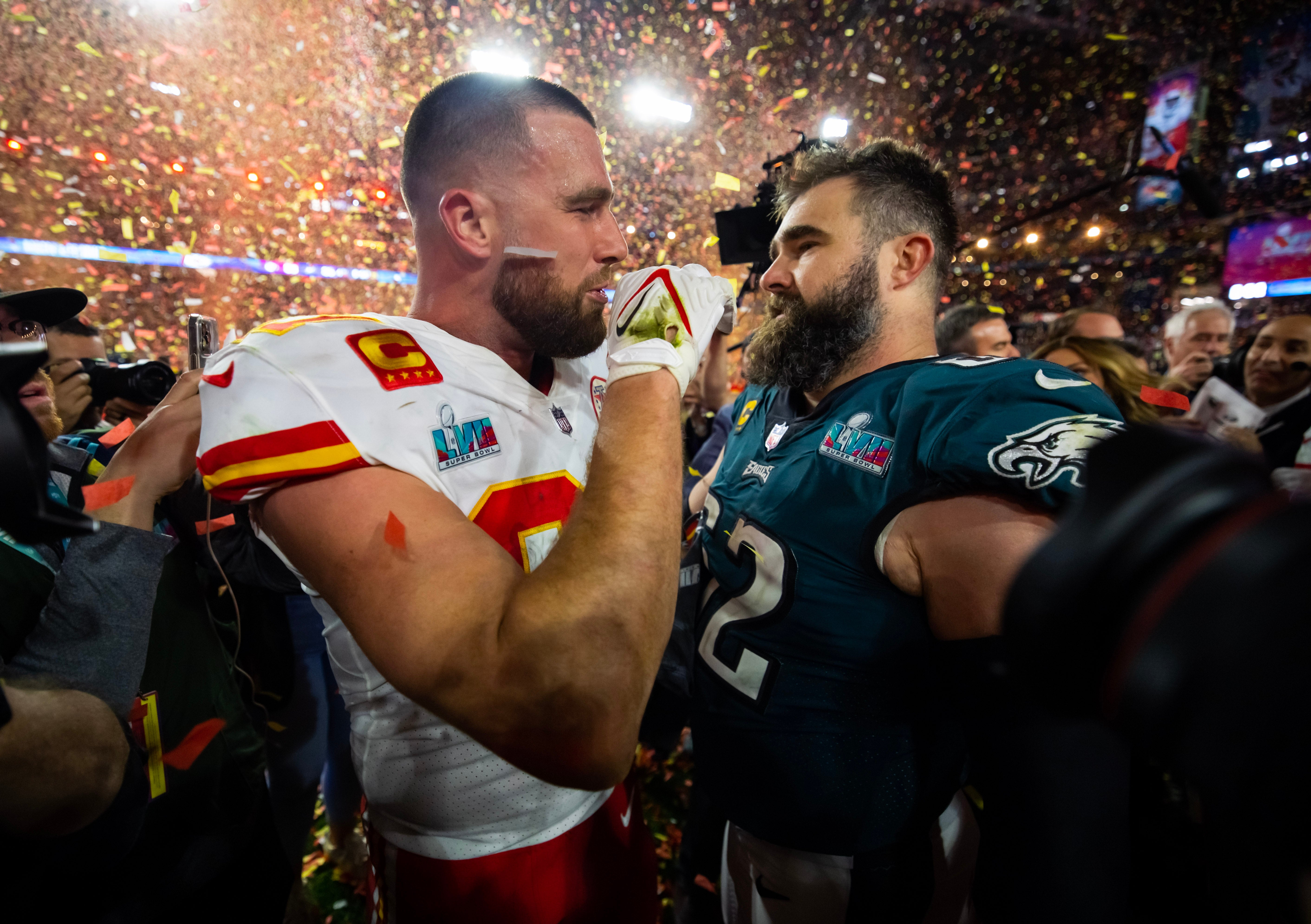 Feb 12, 2023; Glendale, Arizona, US; Kansas City Chiefs tight end Travis Kelce (87) talks with his brother Philadelphia Eagles center Jason Kelce (62) after Super Bowl LVII at State Farm Stadium