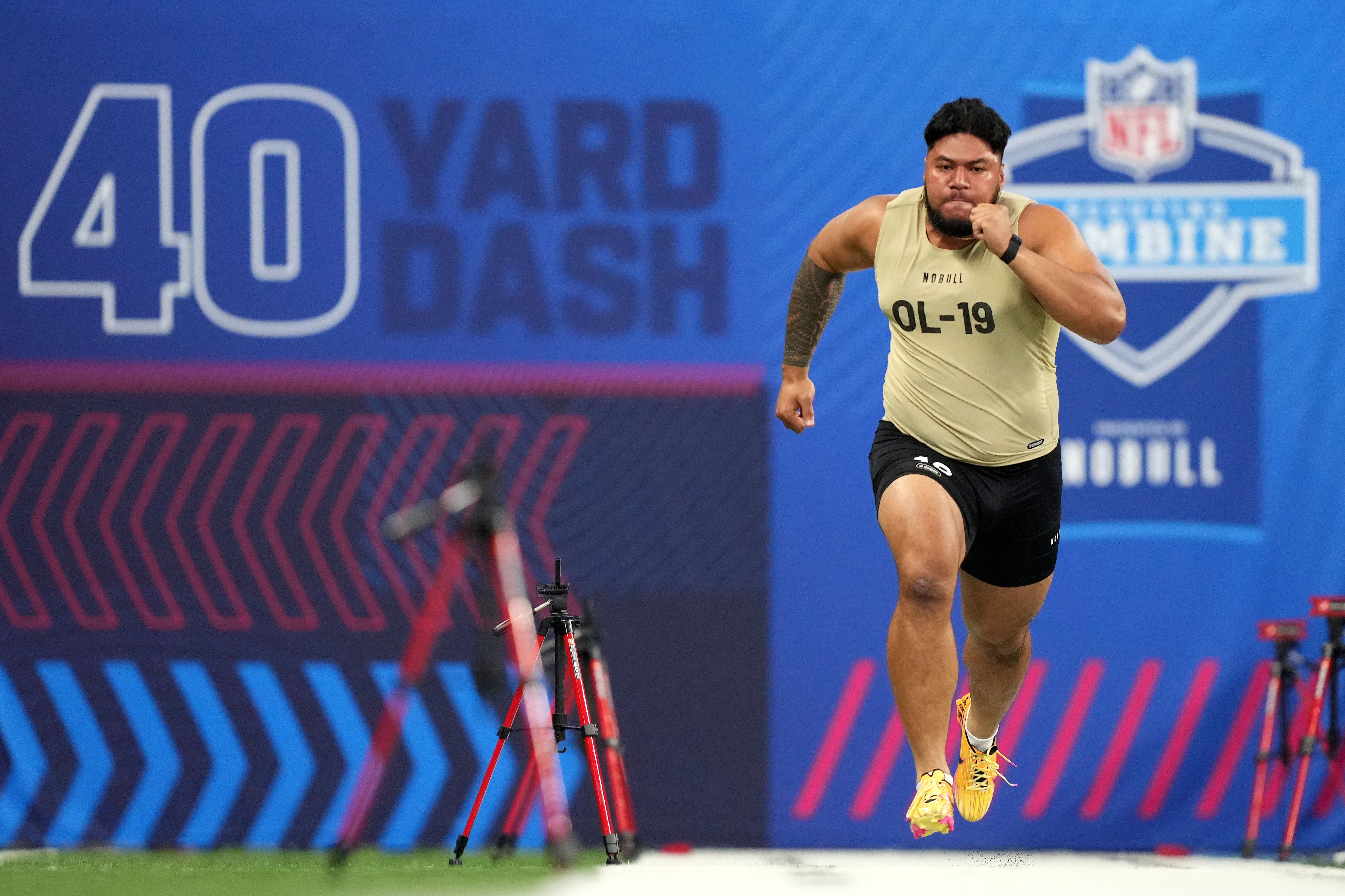 Mar 3, 2024; Indianapolis, IN, USA; Washington offensive lineman Troy Fautanu (OL19) during the 2024 NFL Combine at Lucas Oil Stadium.