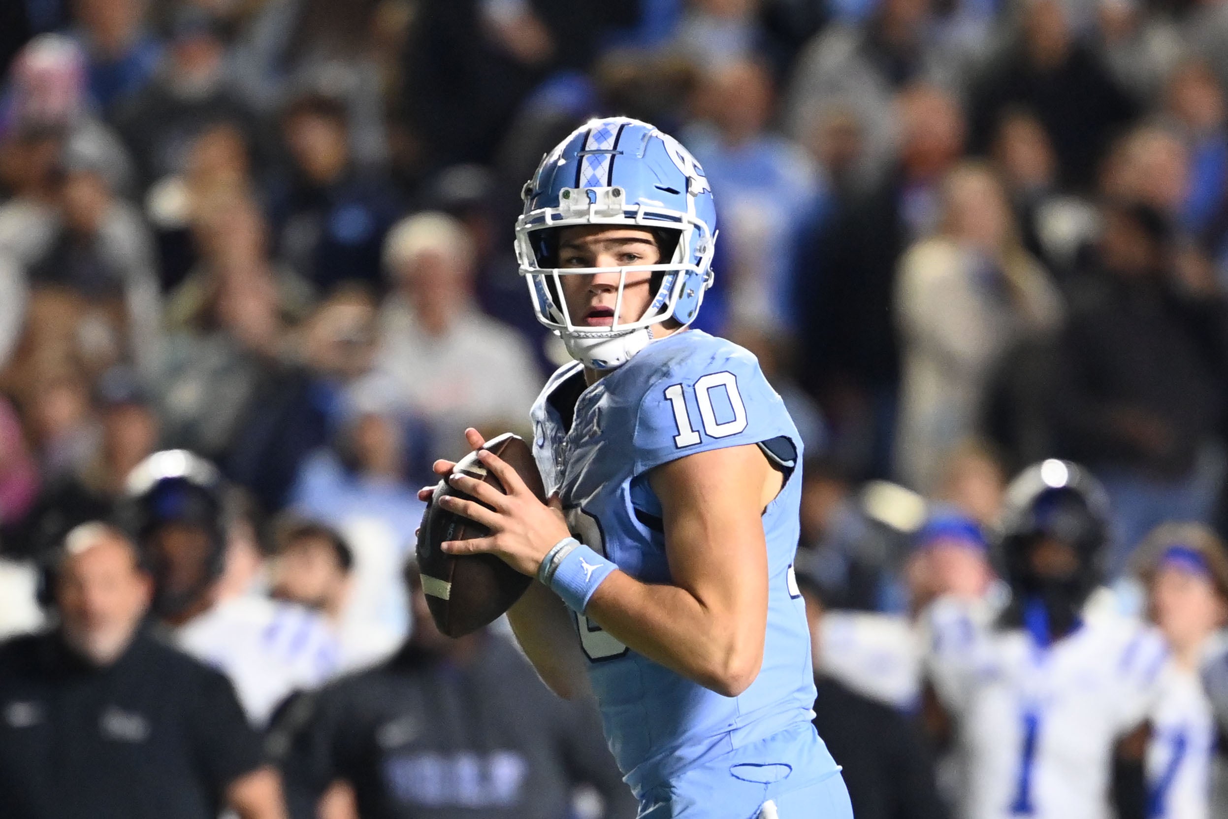 Nov 11, 2023; Chapel Hill, North Carolina, USA; DUPLICATE***North Carolina Tar Heels quarterback Drake Maye (10)***North Carolina Tar Heels defensive lineman Desmond Evans (10) looks to pass in the second quarter at Kenan Memorial Stadium.