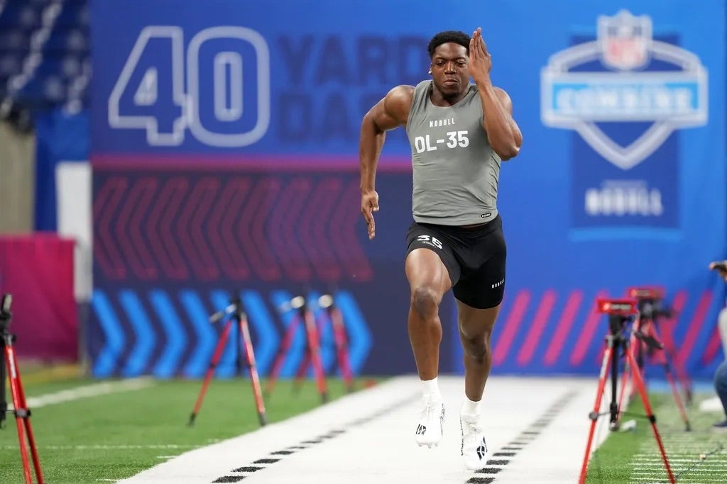 Penn State defensive lineman Adisa Isaac (DL35) works out during the 2024 NFL Combine at Lucas Oil Stadium.