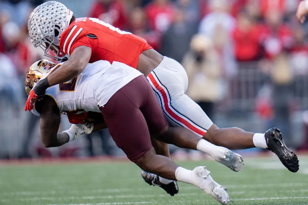 Ohio State Buckeyes safety Sonny Styles (6) tackles Minnesota Golden Gophers running back Zach Evans (26) during the first half of their game on Saturday, Nov. 18, 2023 at Ohio Stadium