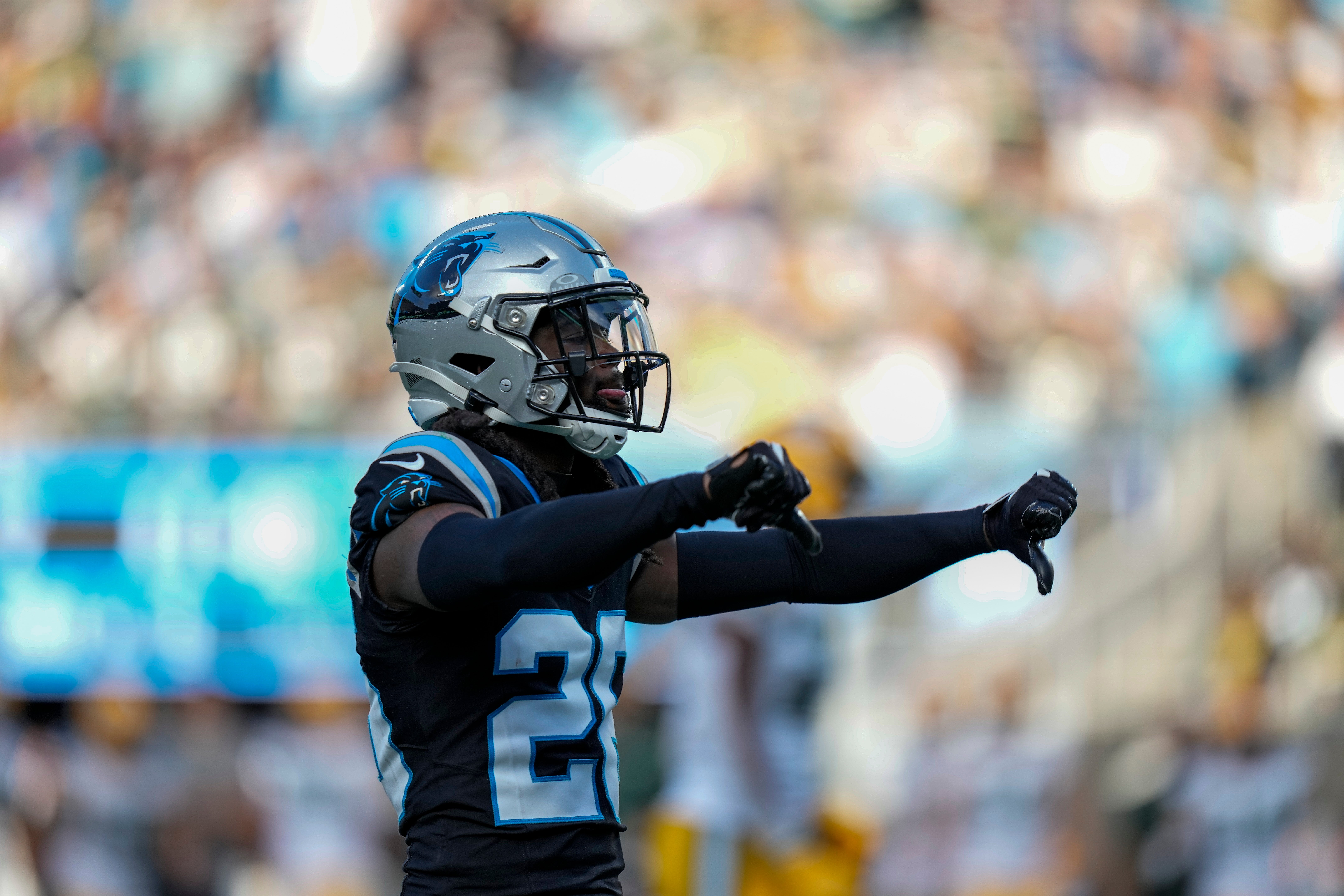 Dec 24, 2023; Charlotte, North Carolina, USA; Carolina Panthers cornerback Donte Jackson (26) reacts to a defensive stop against the Green Bay Packers during the second half at Bank of America Stadium. Mandatory Credit: Jim Dedmon-USA TODAY Sports