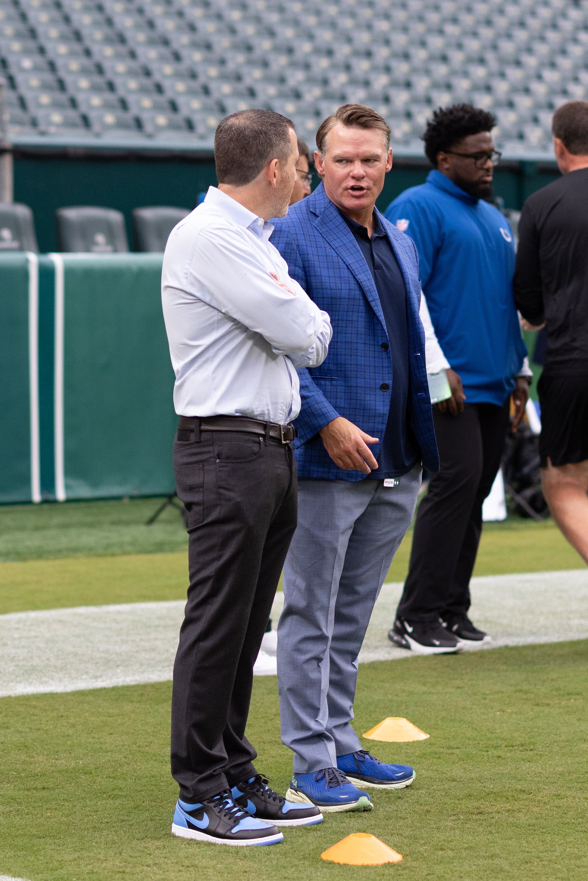 Aug 24, 2023; Philadelphia, Pennsylvania, USA; Indianapolis Colts general manager Chris Ballard (R) talks with Philadelphia Eagles general manager Howie Roseman (L) before the game at Lincoln Financial Field.