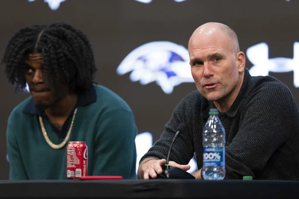 Baltimore Ravens general manager Eric DeCosta answers a question during a press conference alongside quarterback Lamar Jackson at Under Armour Performance Center.