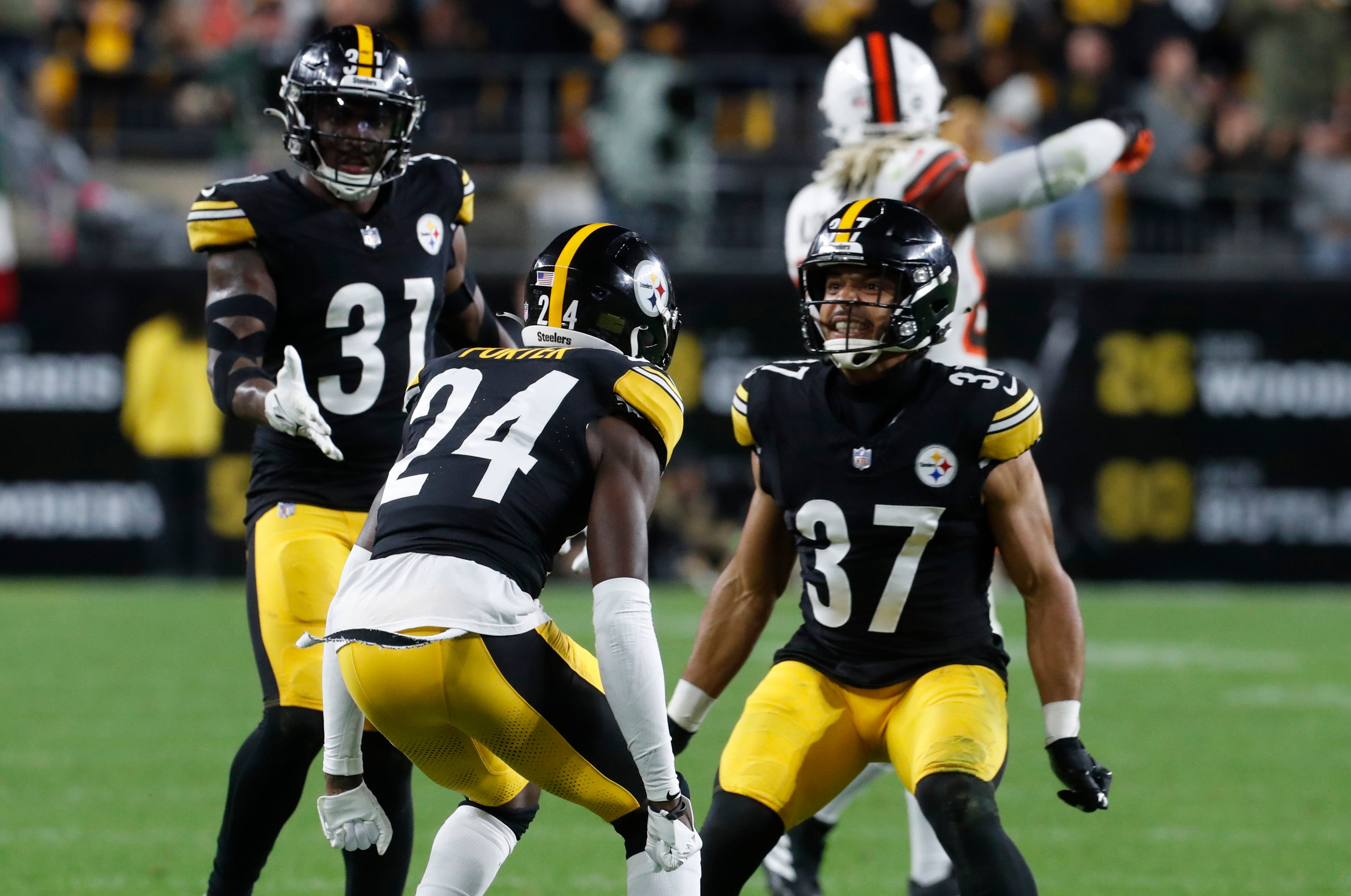 Sep 18, 2023; Pittsburgh, Pennsylvania, USA; Pittsburgh Steelers safety Keanu Neal (31) and safety Elijah Riley (37) congratulate cornerback Joey Porter Jr. (24) on his pass defense on the final defensive play by the Steelers against the Cleveland Browns during the fourth quarter at Acrisure Stadium. Pittsburgh won 26-22. Mandatory Credit: Charles LeClaire-USA TODAY Sports
