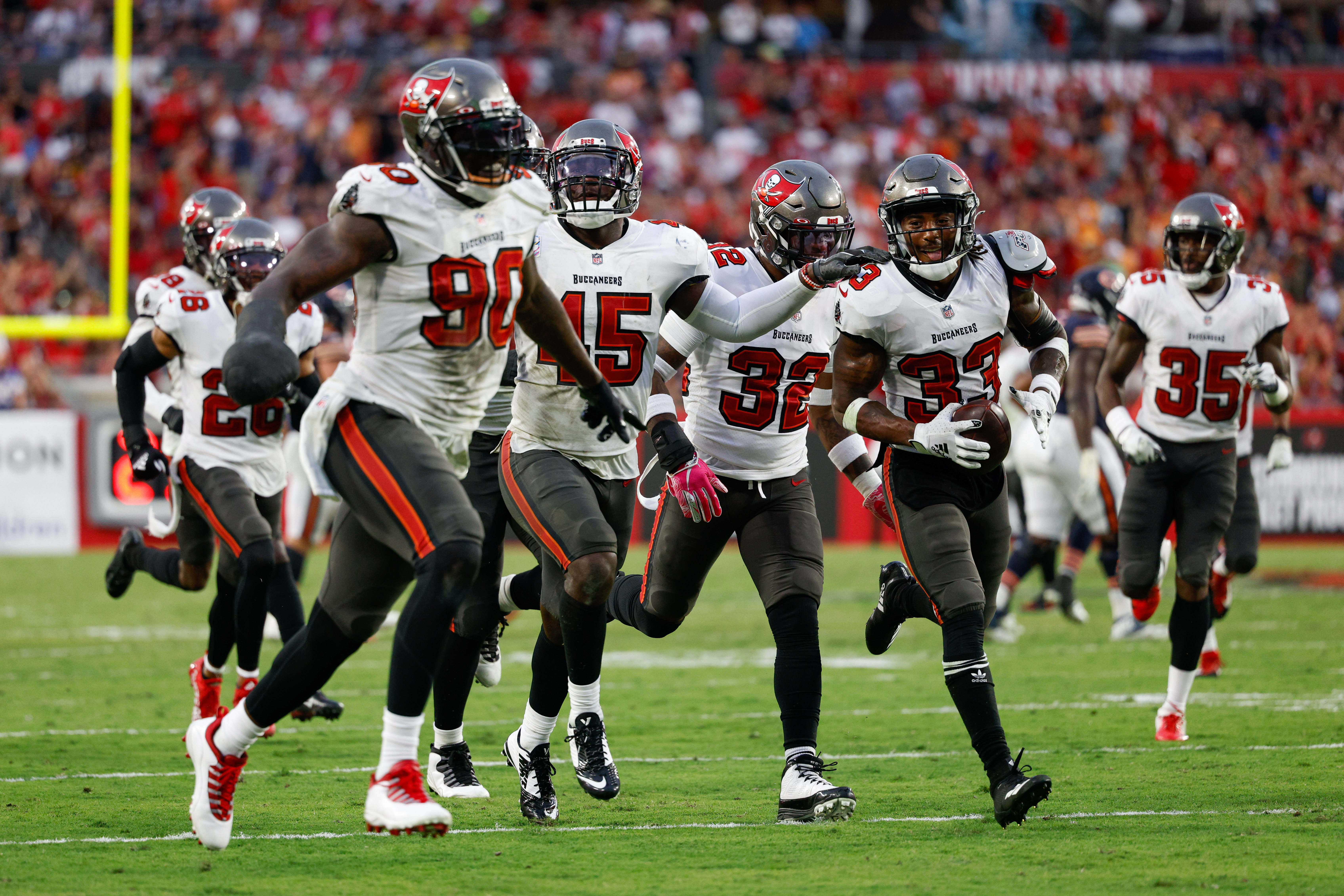 Oct 24, 2021; Tampa, Florida, USA; Tampa Bay Buccaneers free safety Jordan Whitehead (33) reacts after intercepting the ball in the second half against the Chicago Bears at Raymond James Stadium.