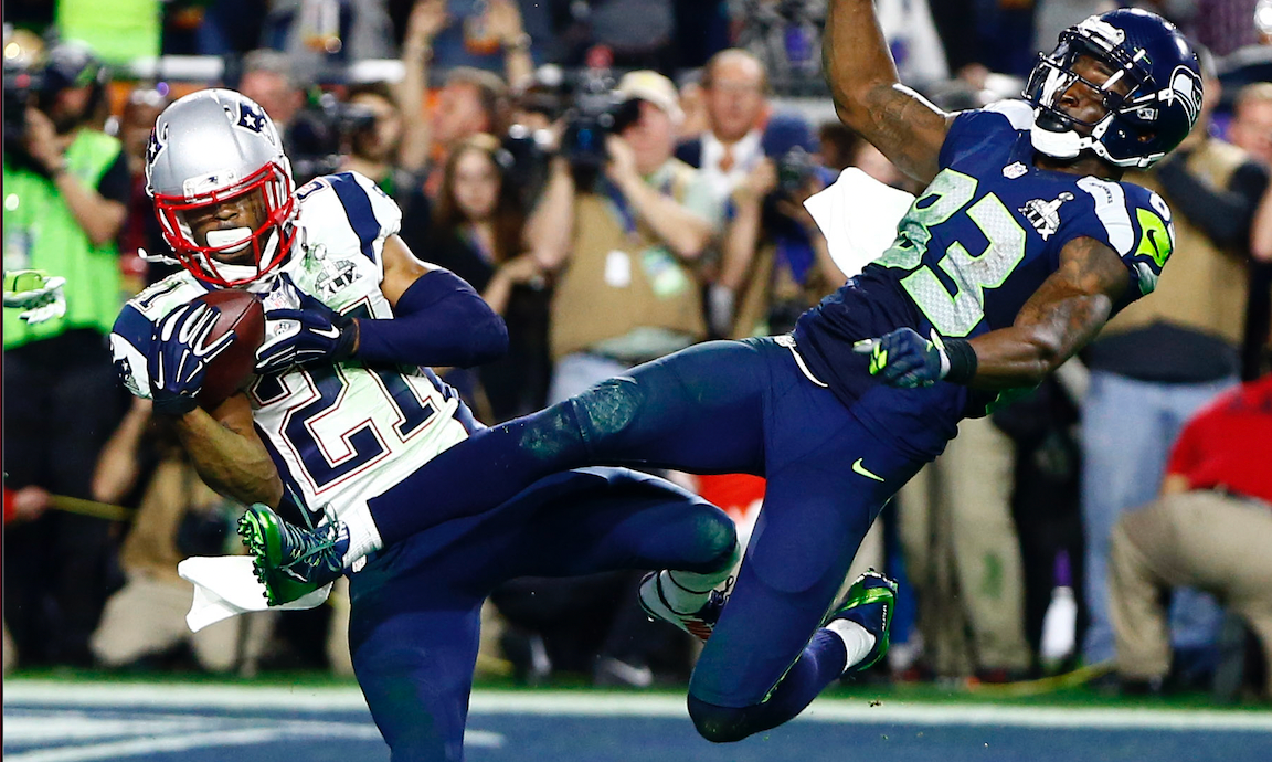 Feb 1, 2015; Glendale, AZ, USA; New England Patriots strong safety Malcolm Butler (21) intercepts a pass intended for Seattle Seahawks wide receiver Ricardo Lockette (83) in the fourth quarter in Super Bowl XLIX at University of Phoenix Stadium.