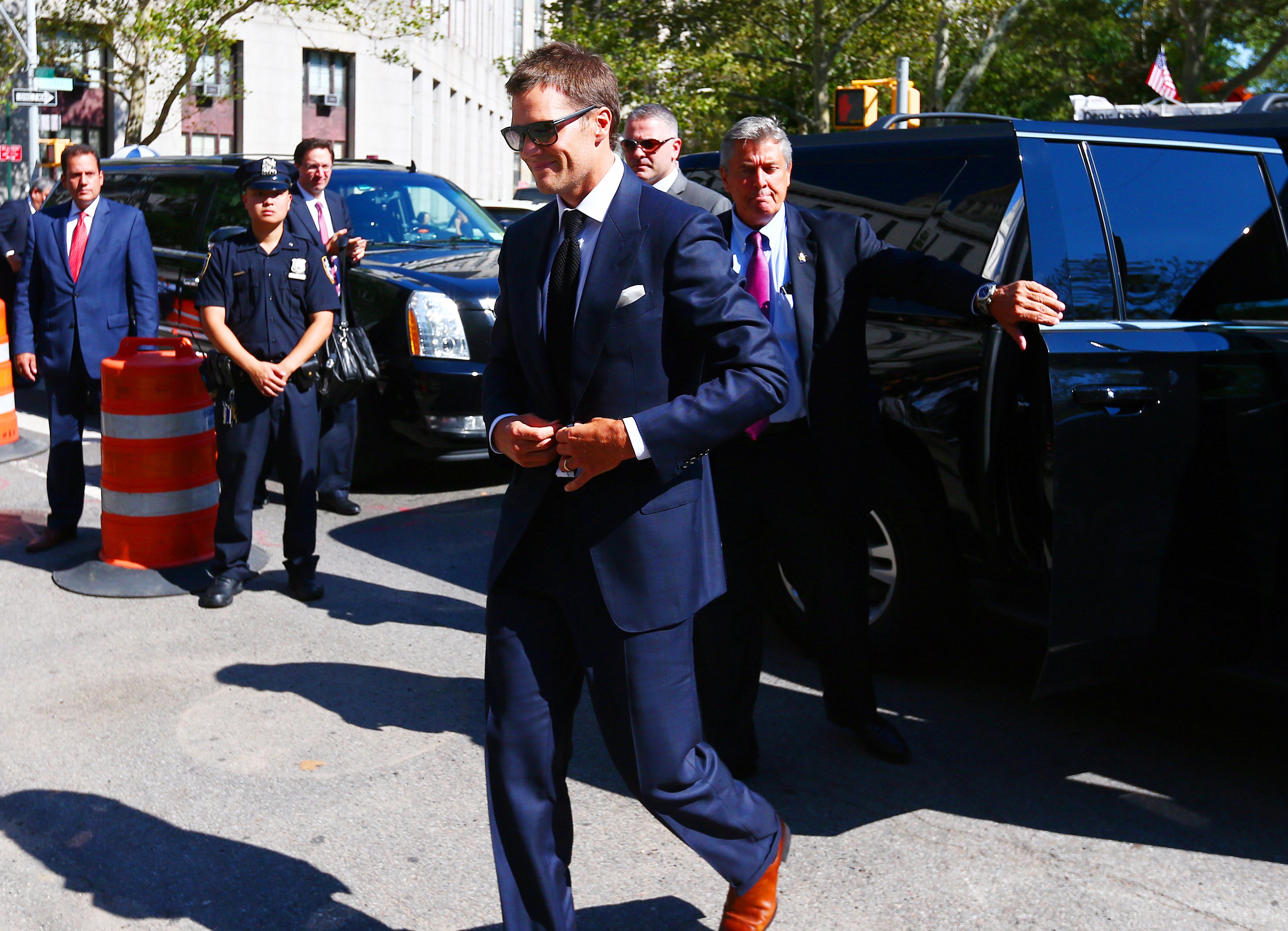 Aug 12, 2015; New York, NY, USA; New England Patriots quarterback Tom Brady enters federal court for a hearing over the legality of Brady's four game suspension for his involvement in the Patriots alleged deflation of footballs prior to last seasons AFC Championship Game against the Indianapolis Colts.