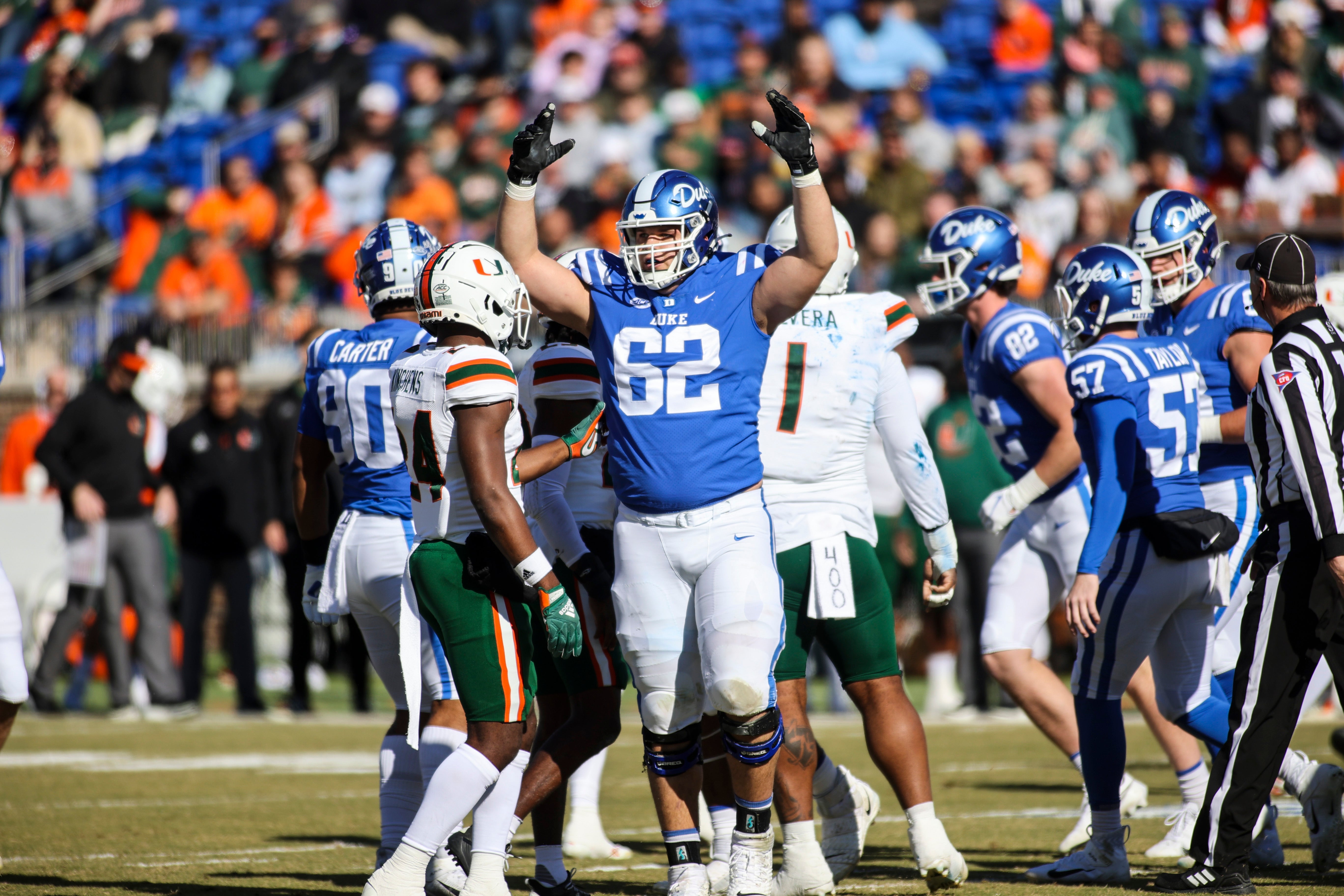 Nov 27, 2021; Durham, North Carolina, USA; Duke Blue Devils offensive tackle Graham Barton (62) celebrates a point during the first half of the game against the Miami Hurricanes at Wallace Wade Stadium. at Wallace Wade Stadium.