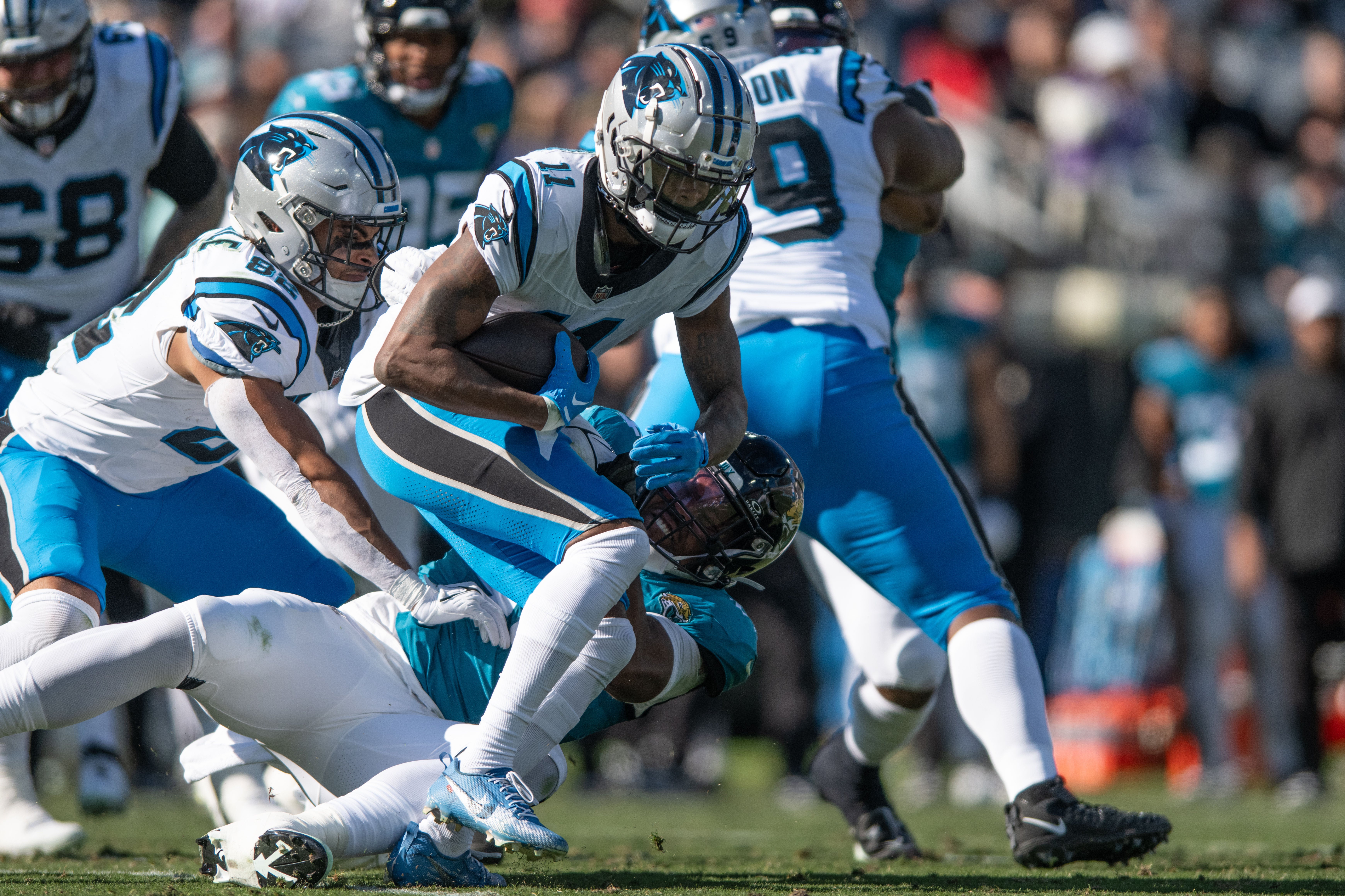 Dec 31, 2023; Jacksonville, Florida, USA; Carolina Panthers wide receiver Ihmir Smith-Marsette (11) runs the ball against the Jacksonville Jaguars in the second quarter at EverBank Stadium. Mandatory Credit: Jeremy Reper-USA TODAY Sports