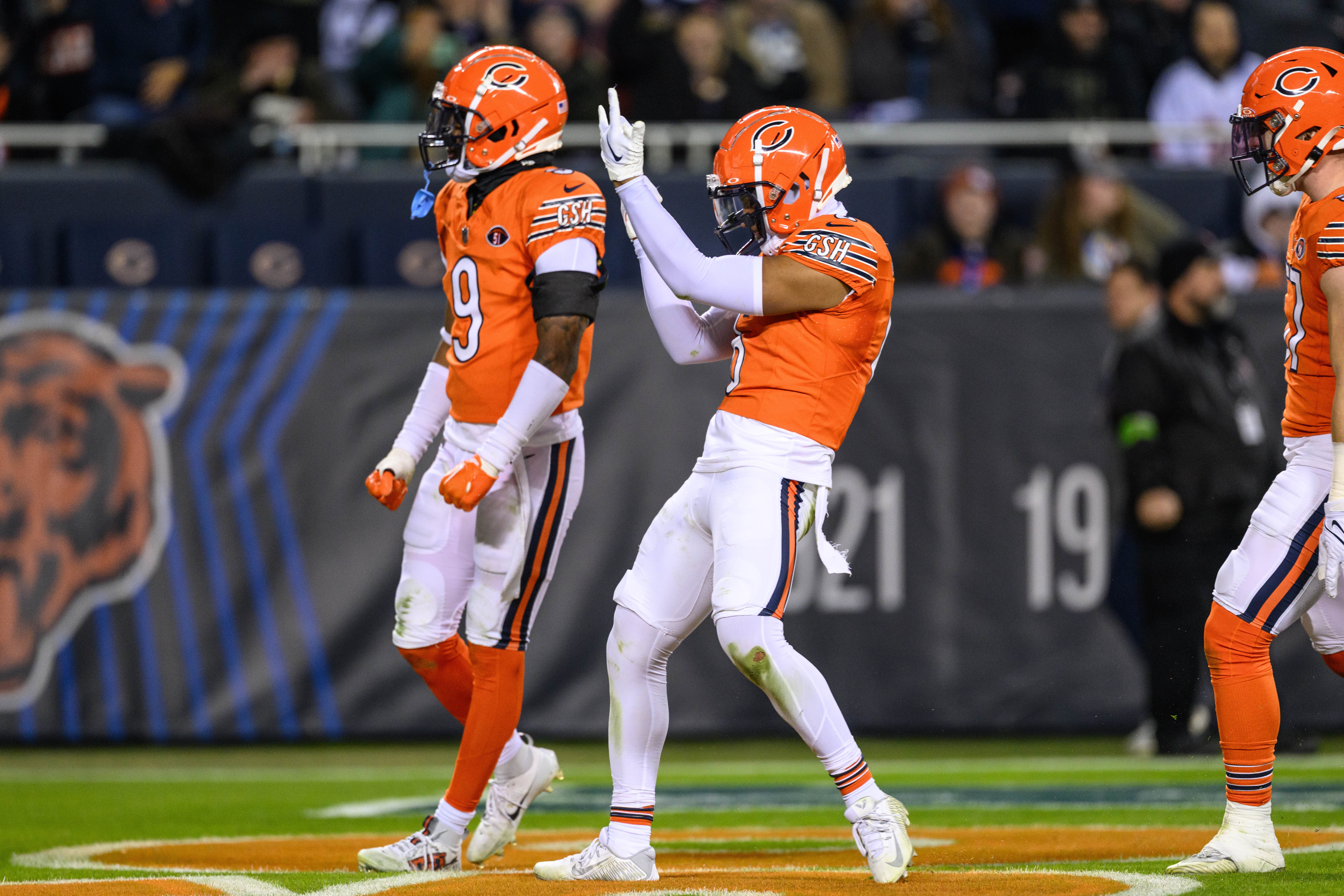 Nov 9, 2023; Chicago, Illinois, USA; Chicago Bears strong safety Jaquan Brisker (9) and defensive back Kyler Gordon (6) celebrate a tackle for a loss against the Carolina Panthers during the third quarter at Soldier Field.