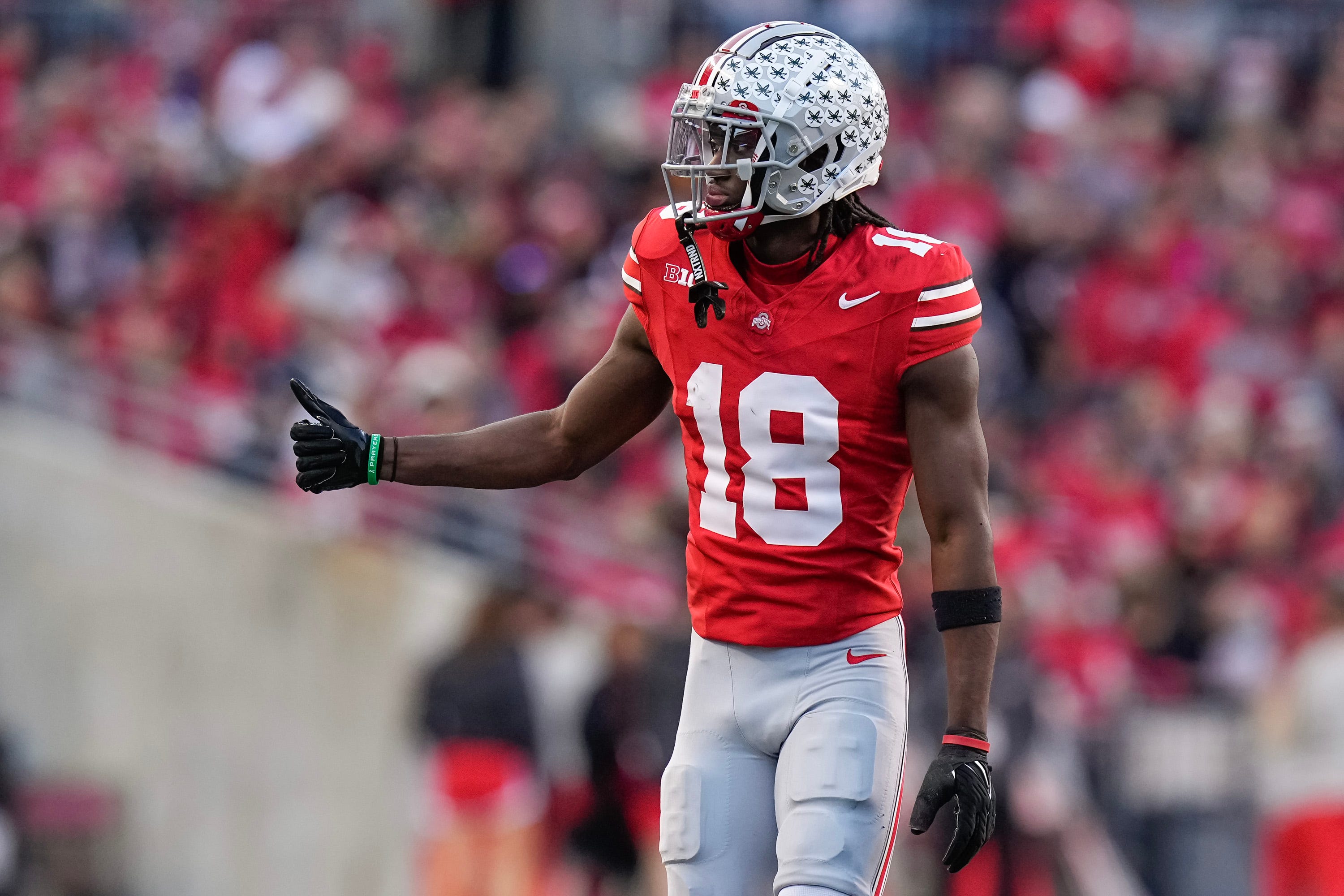 Nov 18, 2023; Columbus, Ohio, USA; Ohio State Buckeyes wide receiver Marvin Harrison Jr. (18) checks in as an eligible receiver during the NCAA football game against the Minnesota Golden Gophers at Ohio Stadium.