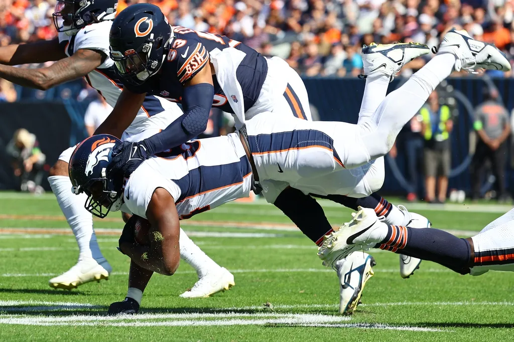Denver Broncos tight end Chris Manhertz (84) makes a catch against Chicago Bears linebacker T.J. Edwards (53) during the first half at Soldier Field.