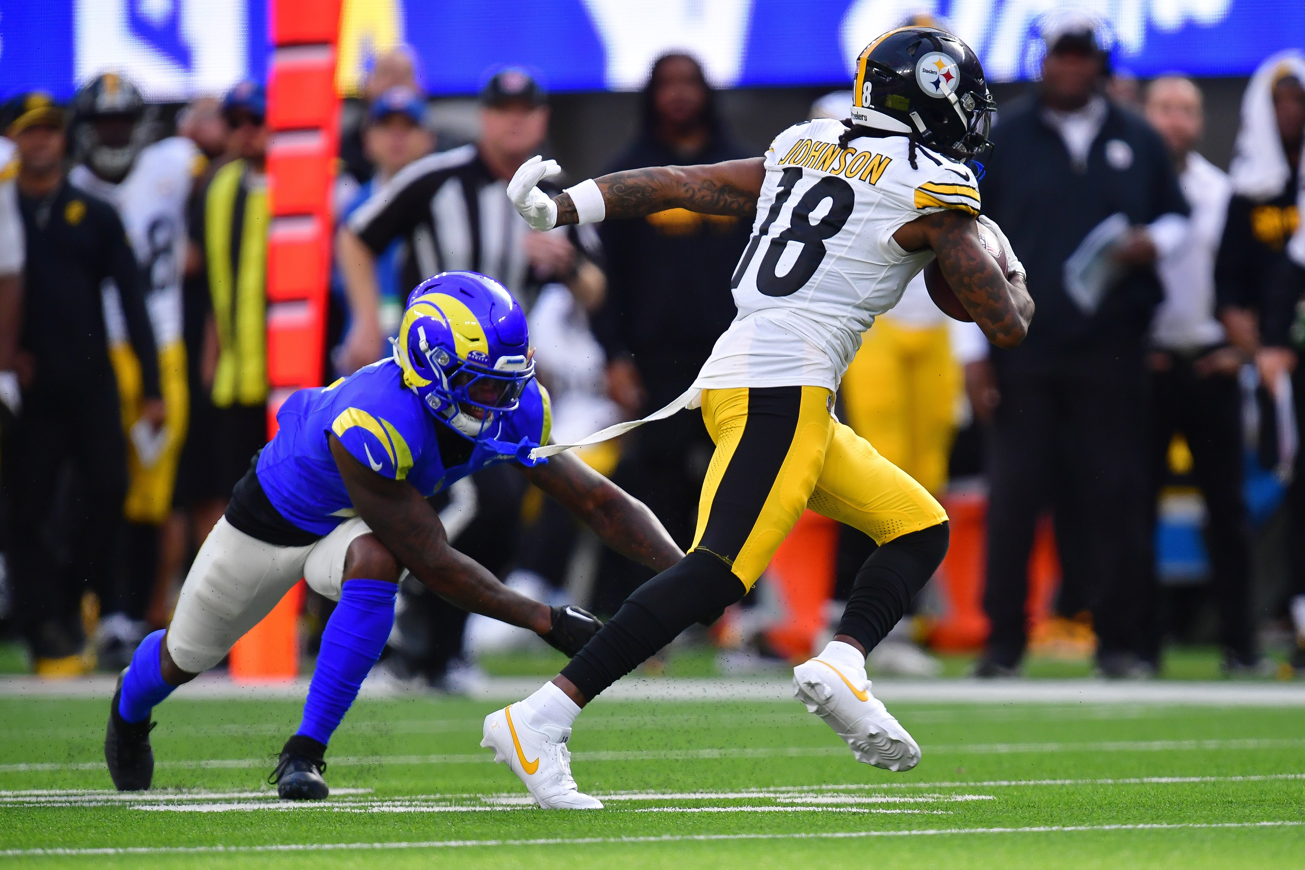 Oct 22, 2023; Inglewood, California, USA; Pittsburgh Steelers wide receiver Diontae Johnson (18) runs the ball against the Los Angeles Rams during the second half at SoFi Stadium. Mandatory Credit: Gary A. Vasquez-USA TODAY Sports
