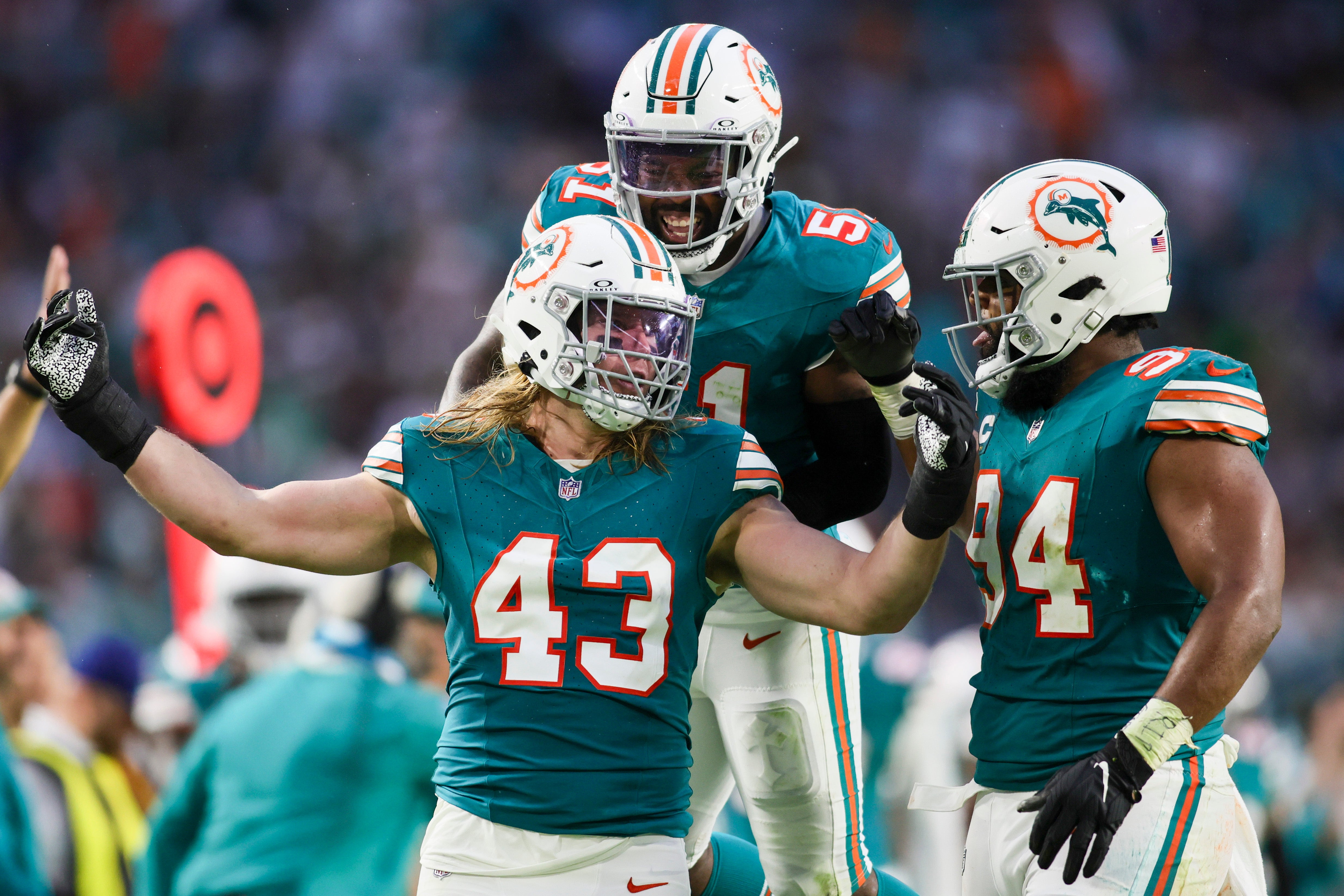 Dec 24, 2023; Miami Gardens, Florida, USA; Miami Dolphins linebacker Andrew Van Ginkel (43) celebrates with defensive tackle Christian Wilkins (94) and linebacker David Long Jr. (51) after a play against the Dallas Cowboys during the second quarter at Hard Rock Stadium.