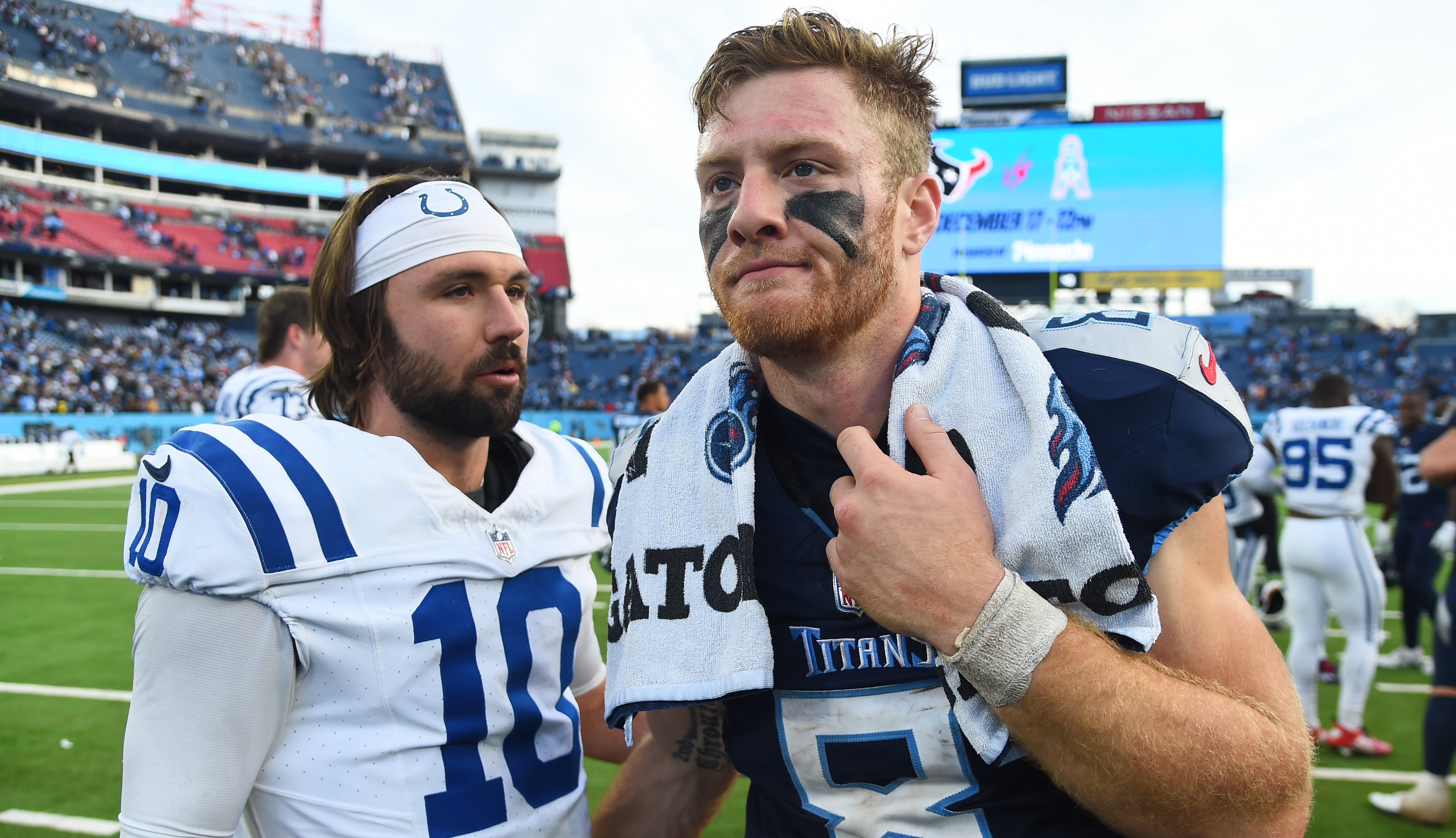 Tennessee Titans quarterback Will Levis (8) and Indianapolis Colts quarterback Gardner Minshew (10) after a Colts win at Nissan Stadium. Christopher Hanewinckel-USA TODAY Sports