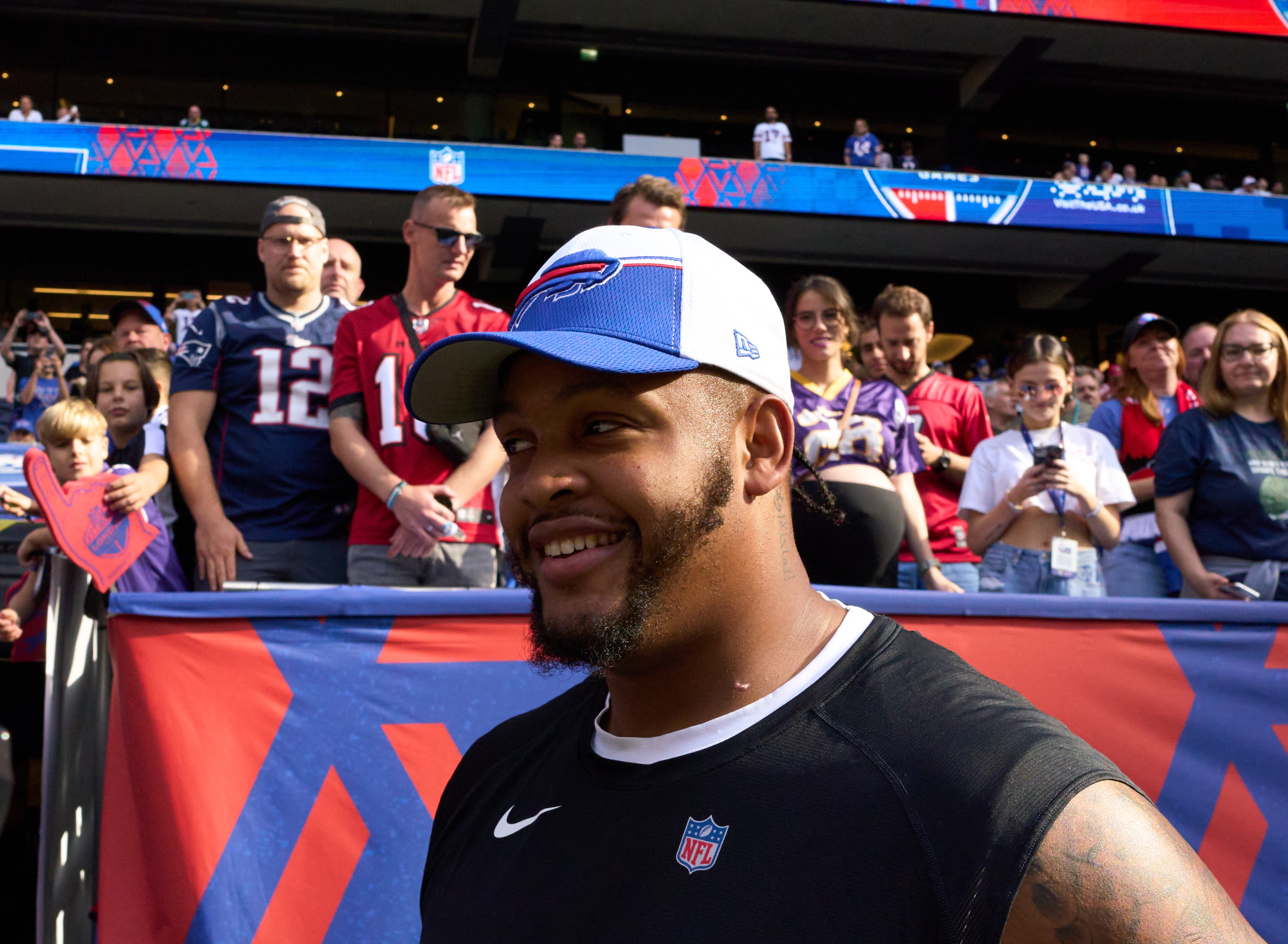 Buffalo Bills OT Dion Dawkins standing on the sidelines.