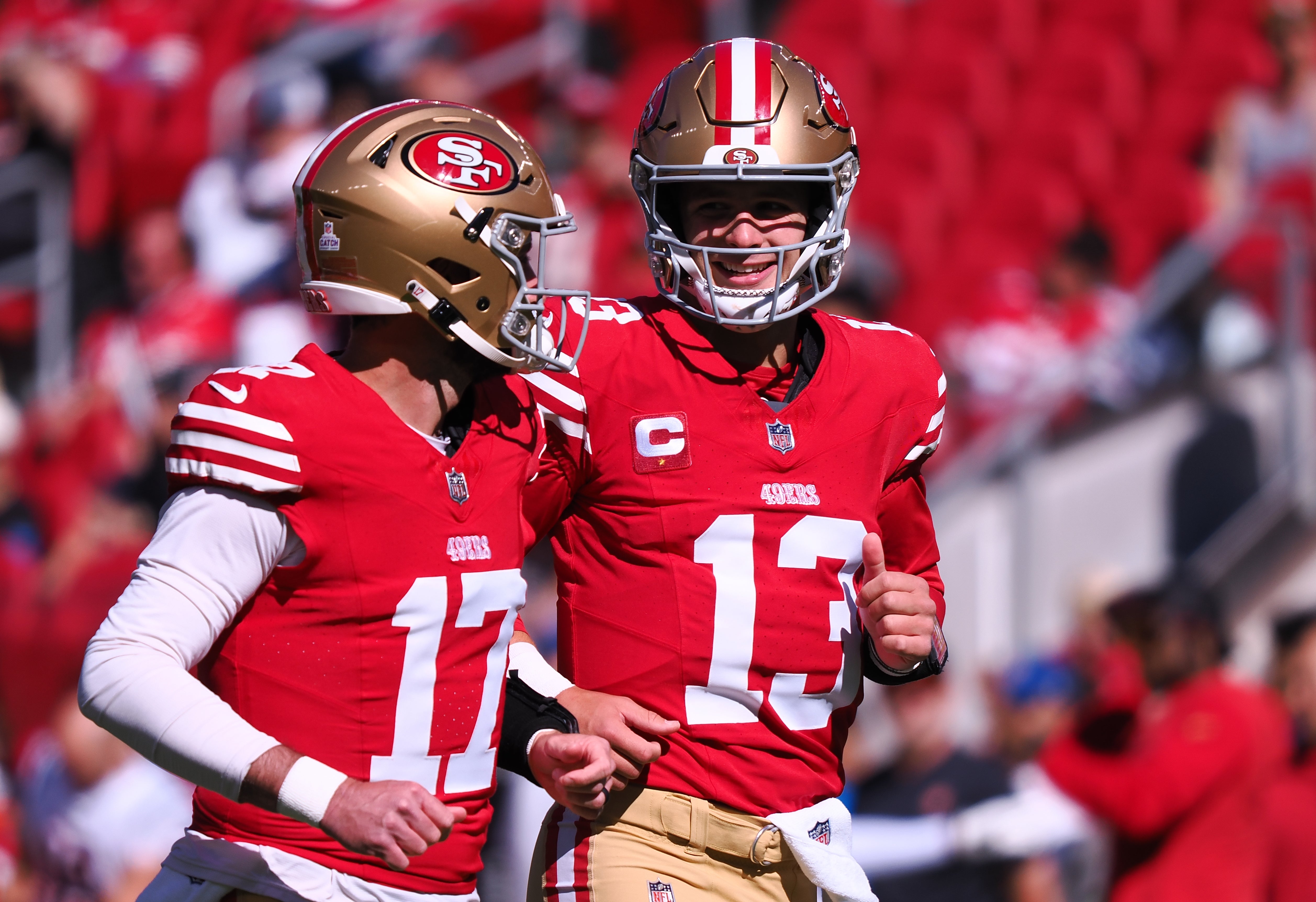Oct 29, 2023; Santa Clara, California, USA; San Francisco 49ers quarterback Brock Purdy (13) smiles with quarterback Brandon Allen (17) before the game against the Cincinnati Bengals at Levi's Stadium.