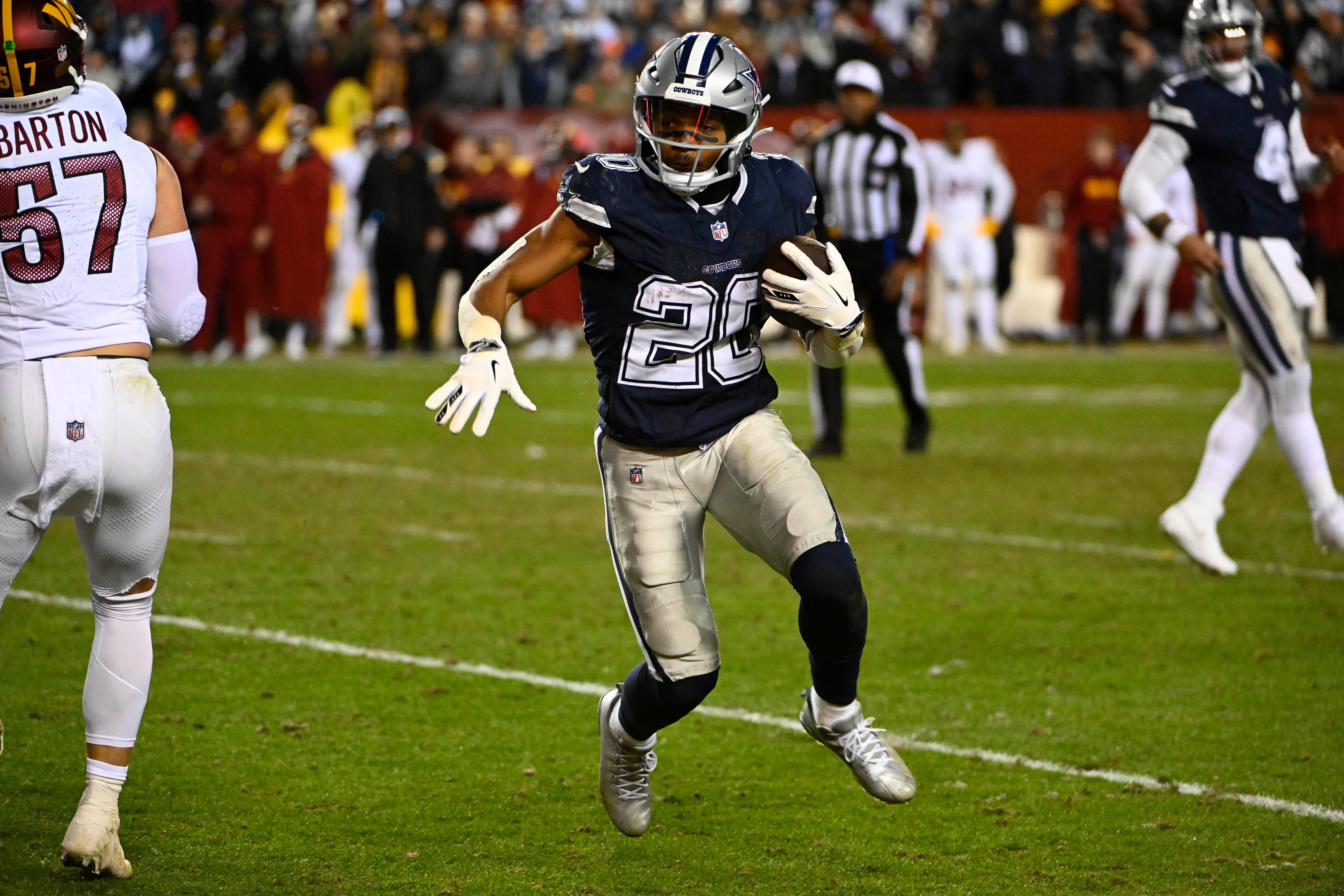 Jan 7, 2024; Landover, Maryland, USA; Dallas Cowboys running back Tony Pollard (20) carries the ball against the Washington Commanders during the second half at FedExField.