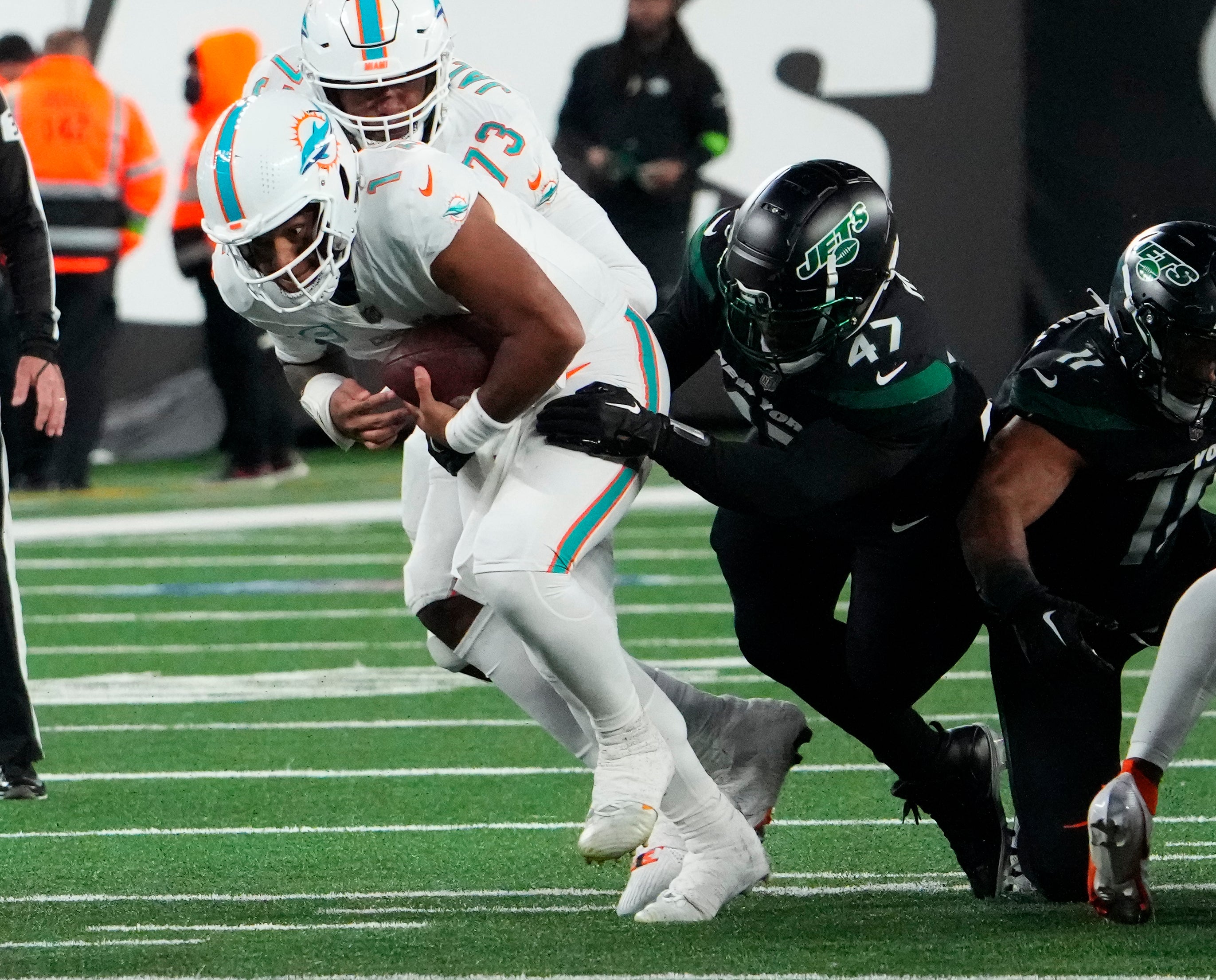 Nov 24, 2023; East Rutherford, New Jersey, USA; New York Jets linebacker Bryce Huff (47) sacks Miami Dolphins quarterback Tua Tagovailoa (1) in the second half at MetLife Stadium.