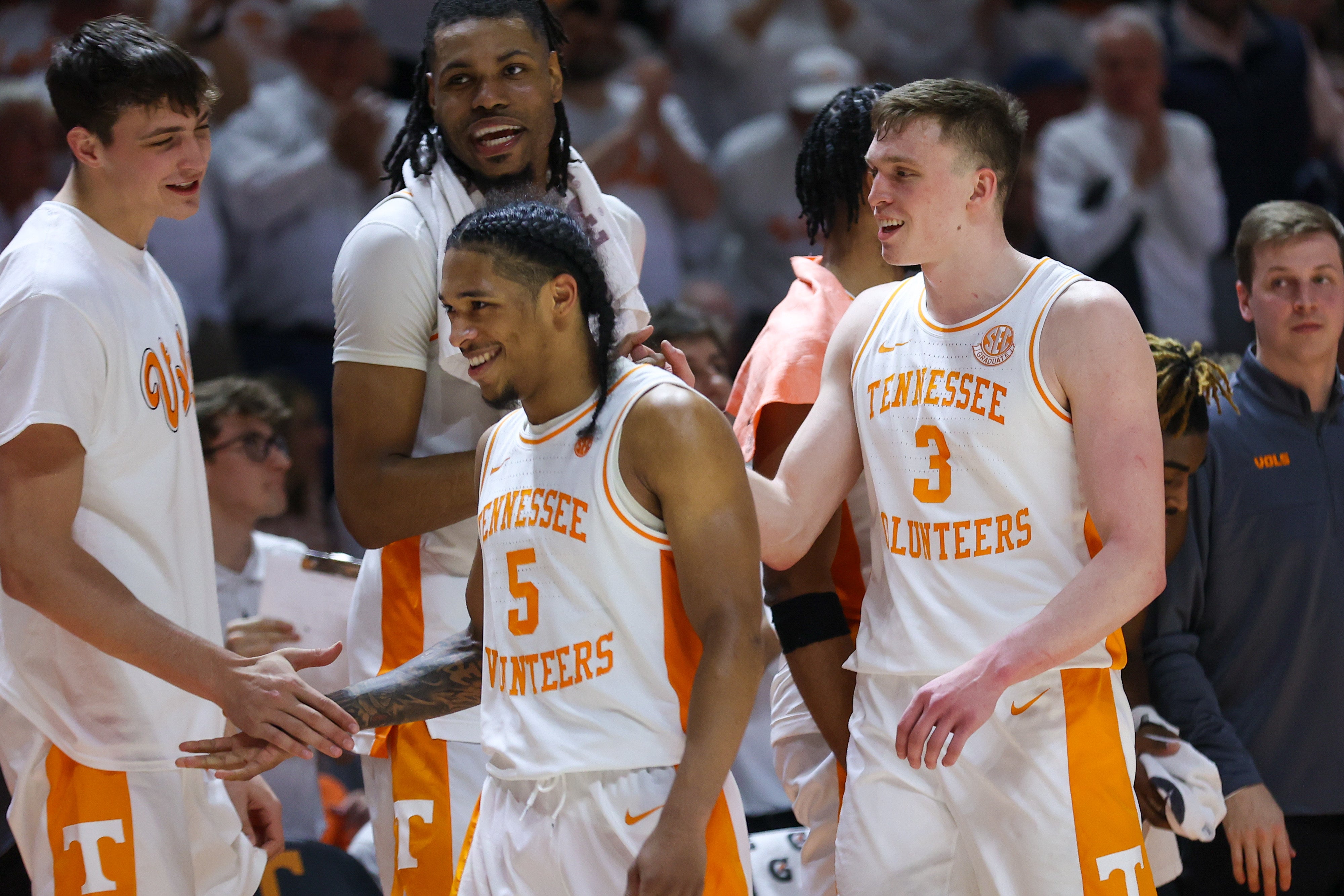 Feb 24, 2024; Knoxville, Tennessee, USA; Tennessee Volunteers guard Zakai Zeigler (5) and guard Dalton Knecht (3) are greeted by teammates during the second half against the Texas A&M Aggies at Thompson-Boling Arena at Food City Center.