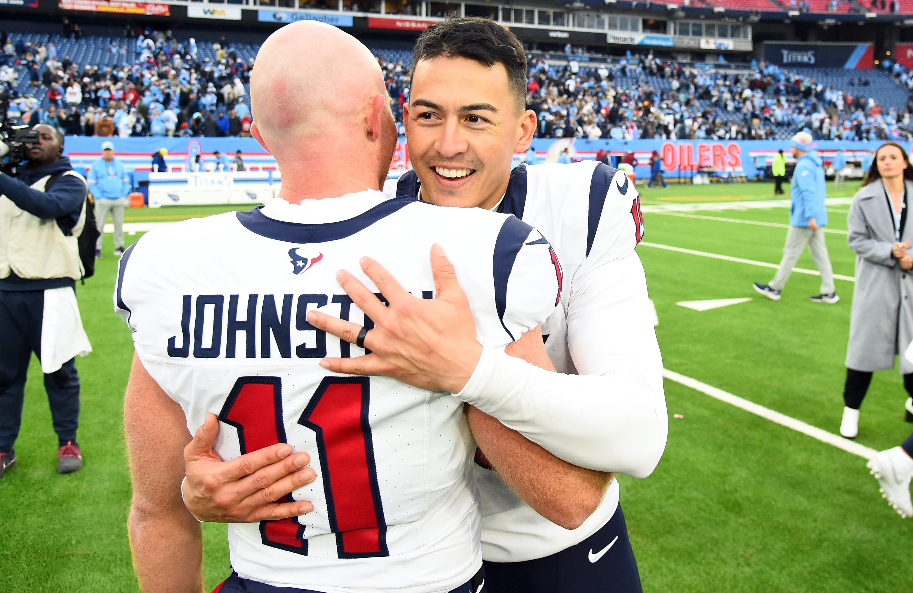Dec 17, 2023; Nashville, Tennessee, USA; Houston Texans place kicker Ka'imi Fairbairn (15) celebrates with punter Cameron Johnston (11) after an overtime win against the Tennessee Titans at Nissan Stadium. Mandatory Credit: Christopher Hanewinckel-USA TODAY Sports