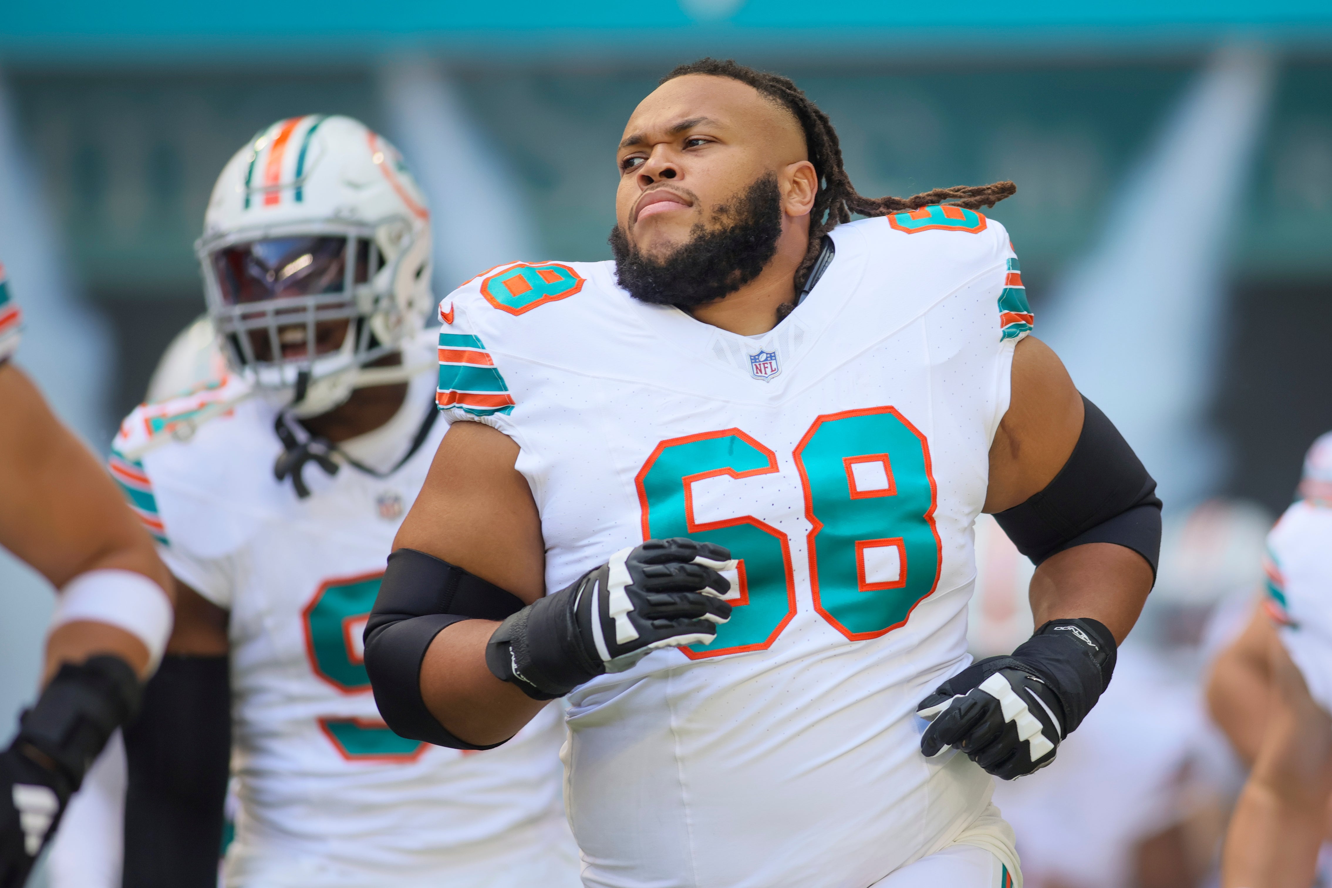 Oct 29, 2023; Miami Gardens, Florida, USA; Miami Dolphins offensive tackle Robert Hunt (68) runs on the field prior to the game against the New England Patriots at Hard Rock Stadium.