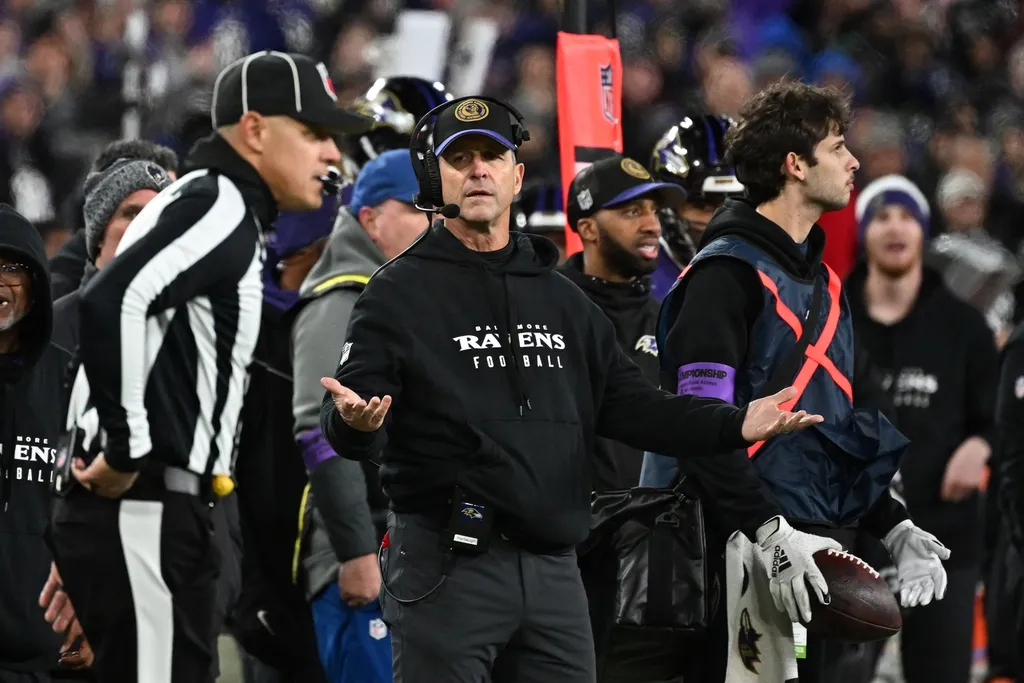 Baltimore Ravens head coach John Harbaugh (center) questions a call against the Kansas City Chiefs during the second half in the AFC Championship football game at M&T Bank Stadium.