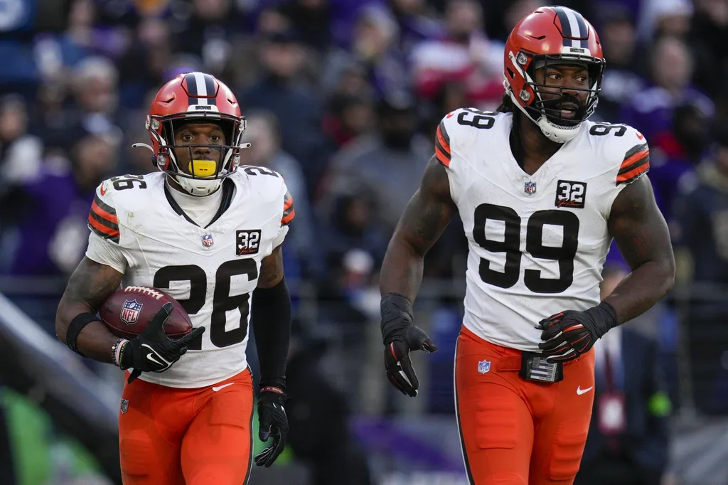 Cleveland Browns safety Rodney McLeod (26) celebrates a defensive play against the Baltimore Ravens with defensive end Za'Darius Smith (99) during the second half at M&T Bank Stadium.