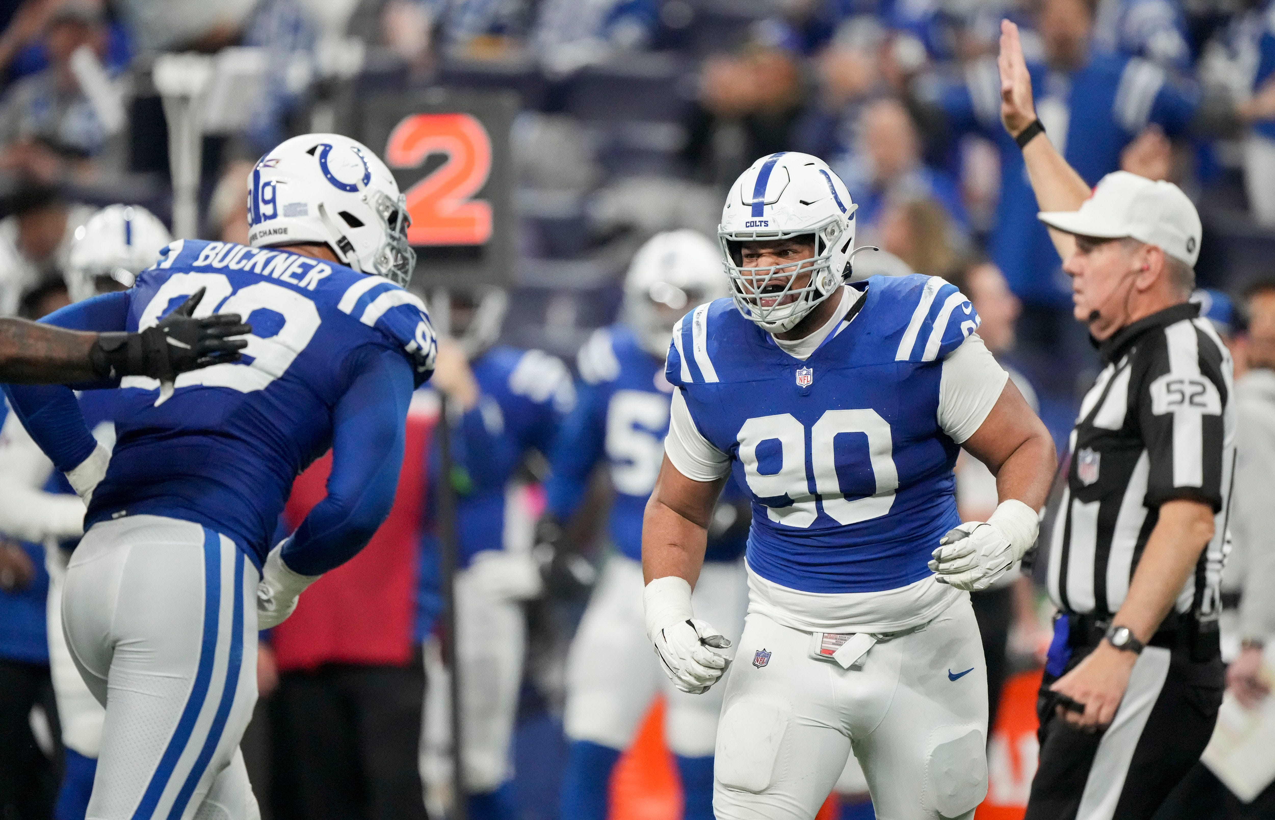 Indianapolis Colts defensive tackle DeForest Buckner (99) and Indianapolis Colts defensive tackle Grover Stewart (90) celebrate a play Saturday, Jan. 6, 2024, during a game against the Houston Texans at Lucas Oil Stadium in Indianapolis.