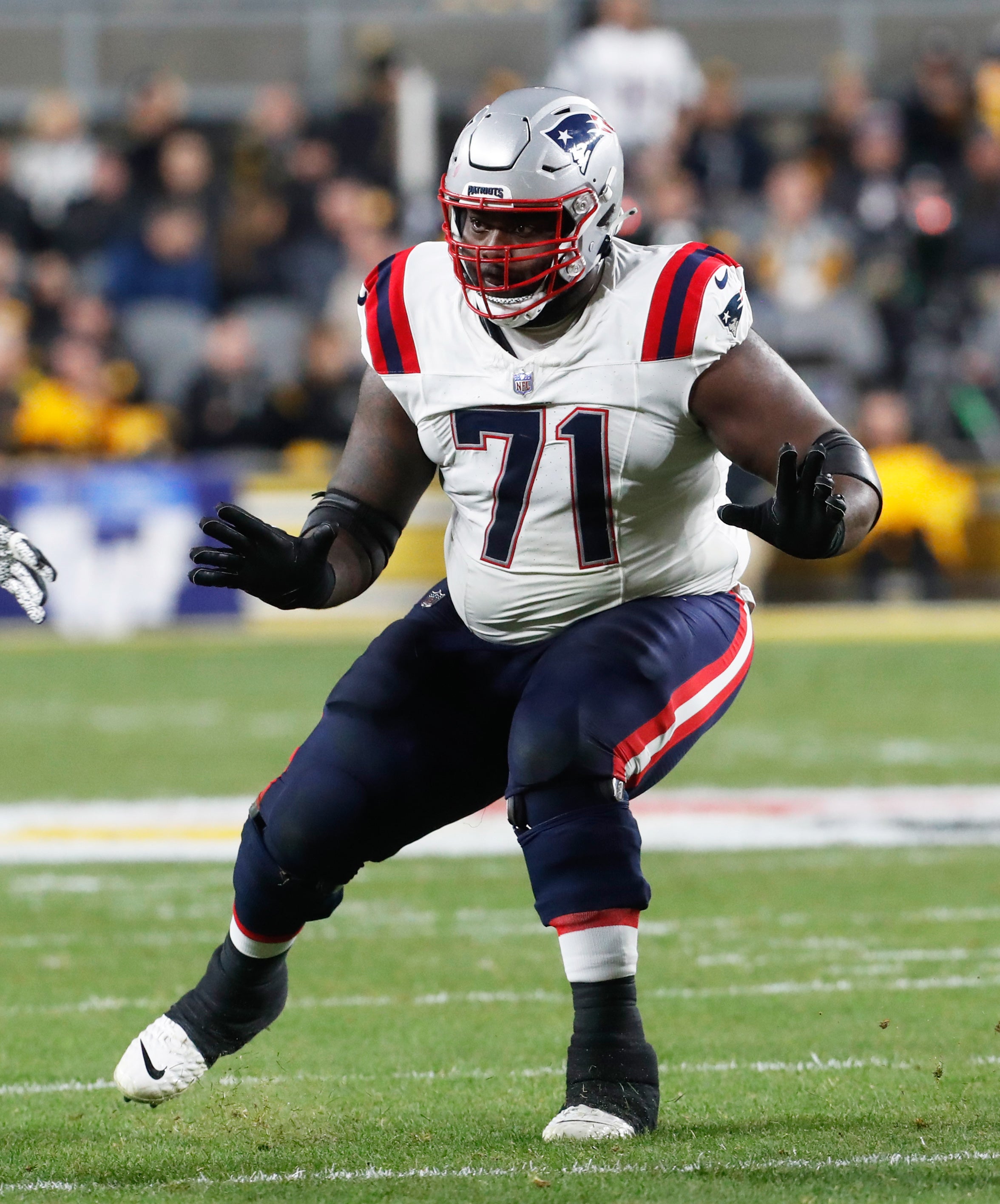Dec 7, 2023; Pittsburgh, Pennsylvania, USA; New England Patriots guard Mike Onwenu (71) blocks at the line of scrimmage against the Pittsburgh Steelers during the second quarter at Acrisure Stadium. 