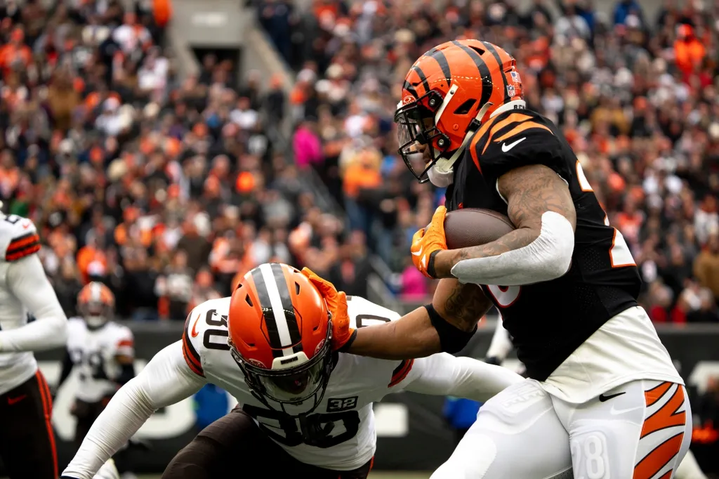 Cleveland Browns safety Duron Harmon (30) takes Cincinnati Bengals halfback Joe Mixon (28) in the second quarter of the NFL game between Cincinnati Bengals and Cleveland Browns