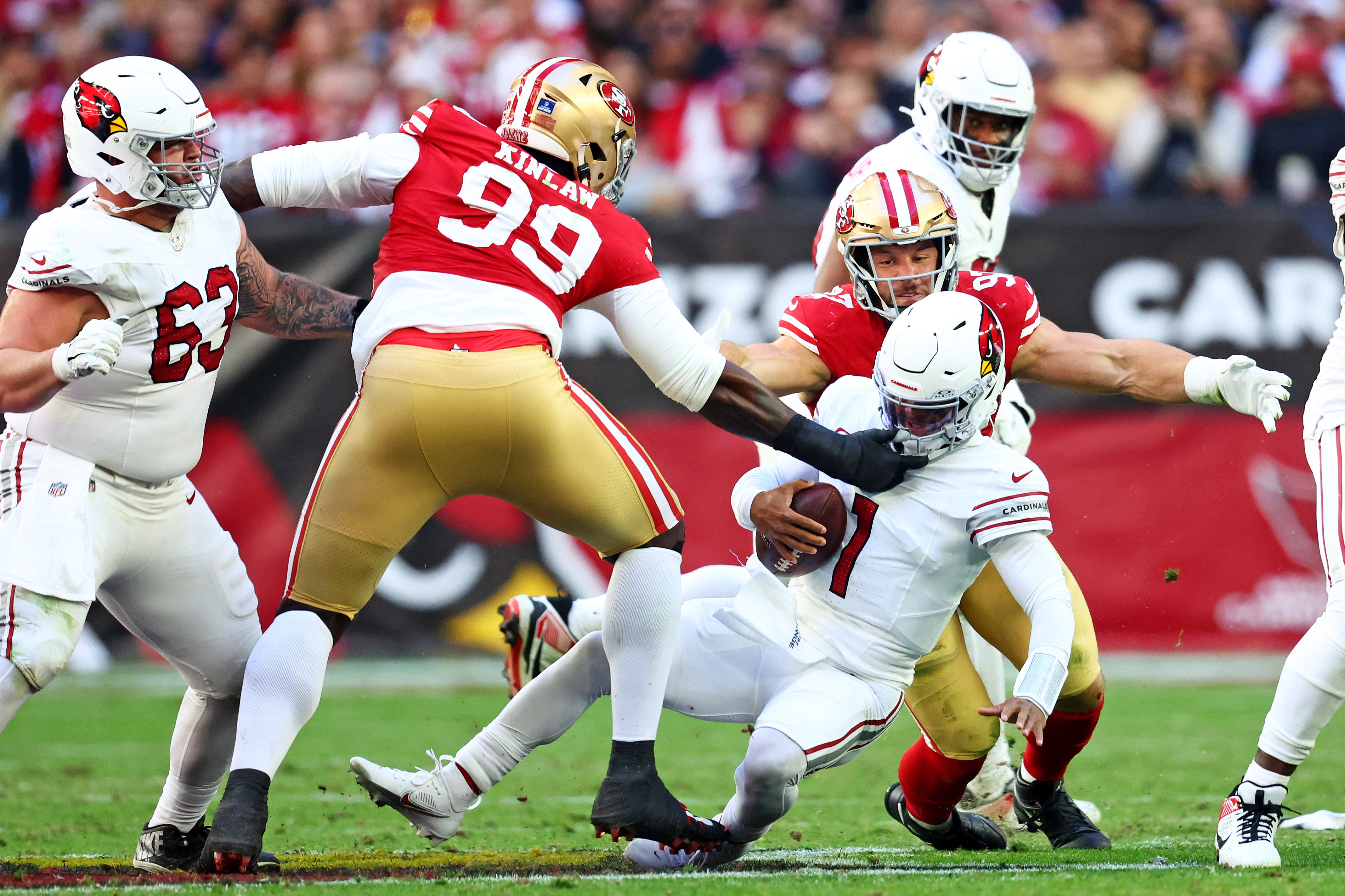 Dec 17, 2023; Glendale, Arizona, USA; San Francisco 49ers defensive tackle Javon Kinlaw (99) and defensive end Nick Bosa (97) sack Arizona Cardinals quarterback Kyler Murray (1) during the first half at State Farm Stadium.