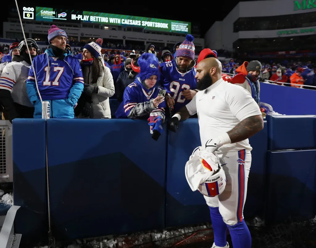 Bills DaQuan Jones stops to talk with fans and take a photo with them before leaving the field. The Bills lost to the Chiefs.