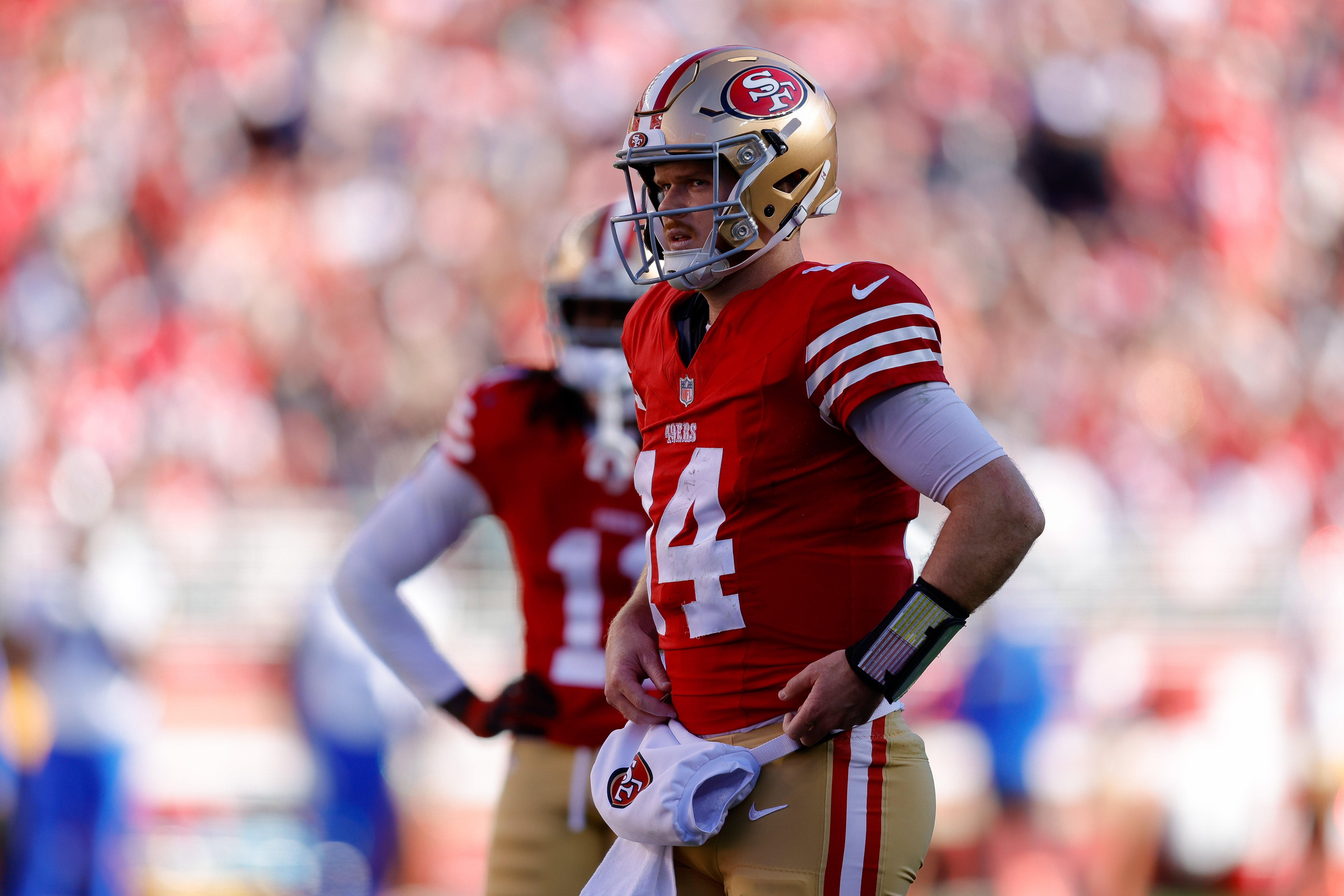 Jan 7, 2024; Santa Clara, California, USA; San Francisco 49ers quarterback Sam Darnold (14) and wide receiver Brandon Aiyuk (11) look on during the second quarter against the Los Angeles Rams at Levi's Stadium.