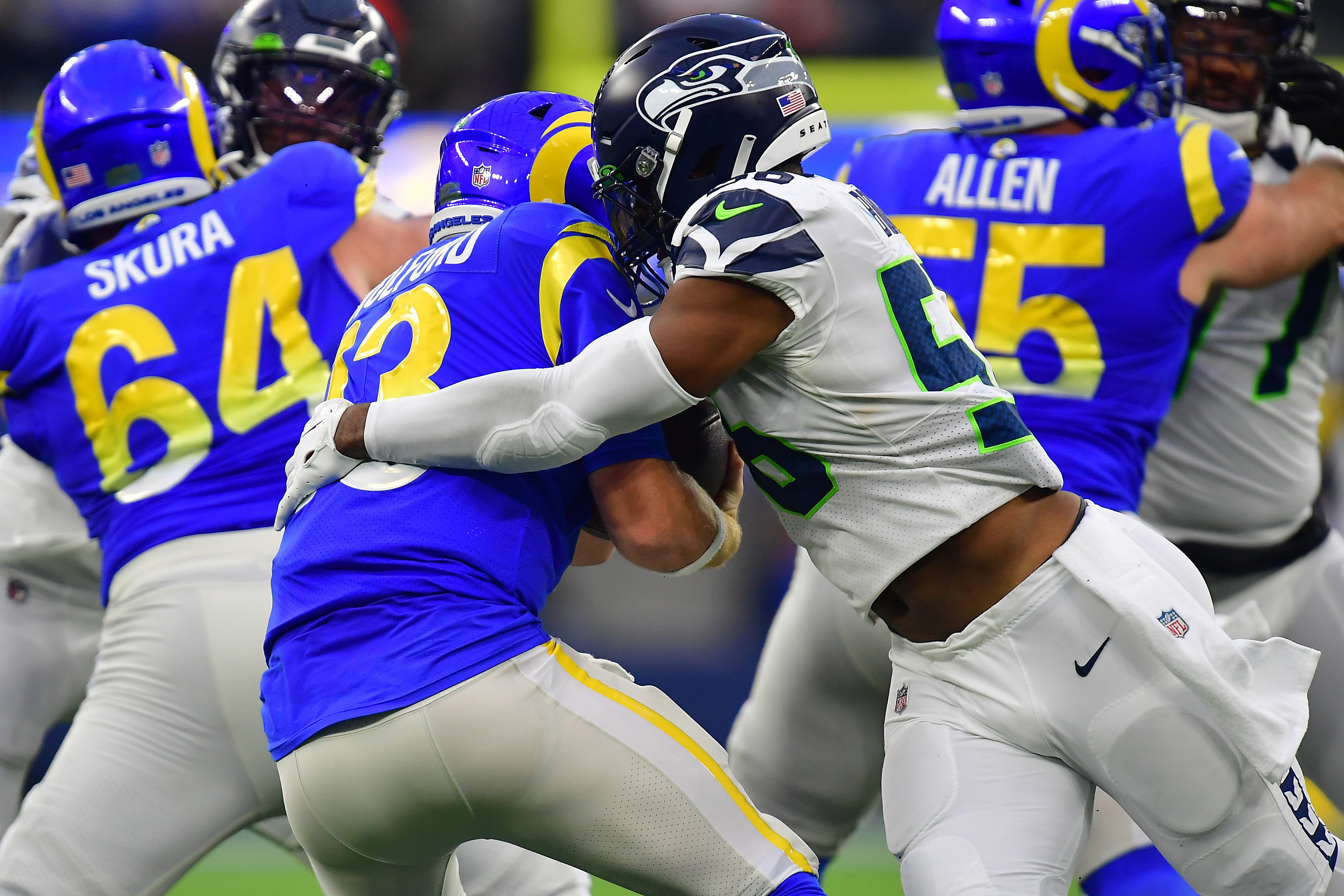 Dec 4, 2022; Inglewood, California, USA; Seattle Seahawks linebacker Jordyn Brooks (56) sacks Los Angeles Rams quarterback John Wolford (13) during the second half at SoFi Stadium.
