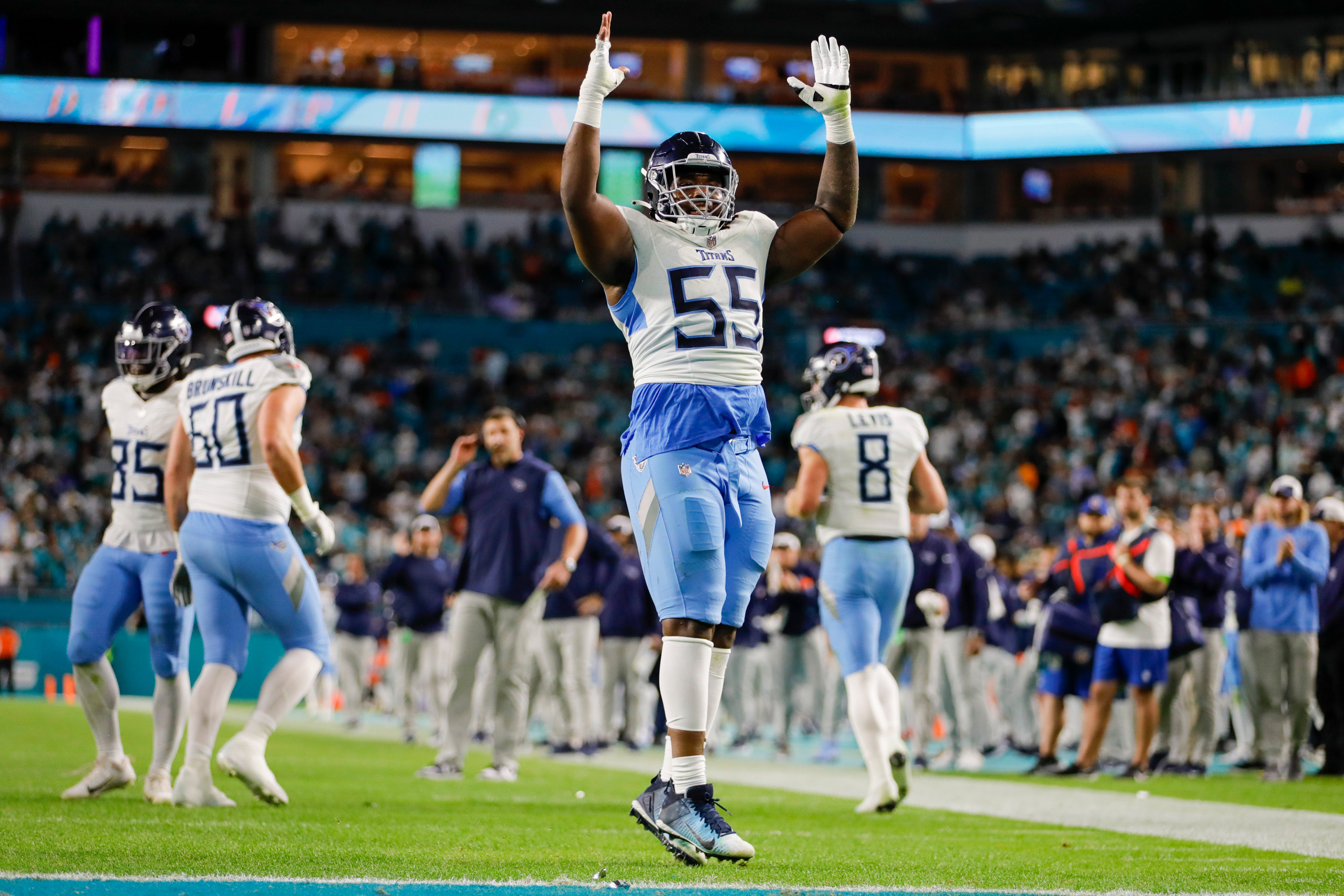 Dec 11, 2023; Miami Gardens, Florida, USA; Tennessee Titans guard Aaron Brewer (55) celebrates after a touchdown by running back Derrick Henry (not pictured) during the fourth quarter at Hard Rock Stadium.