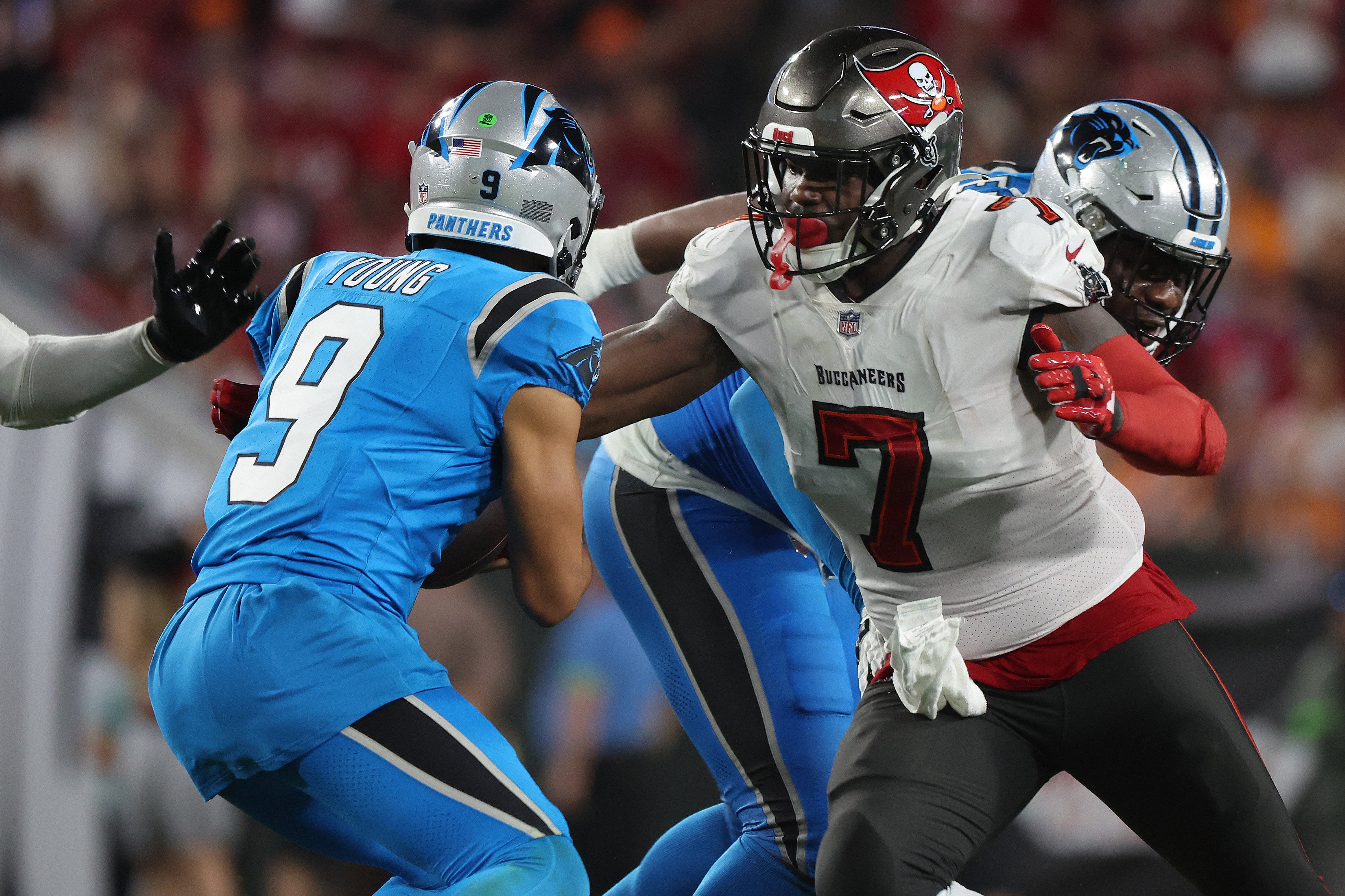 Dec 3, 2023; Tampa, Florida, USA; Tampa Bay Buccaneers linebacker Shaquil Barrett (7) rushes Carolina Panthers quarterback Bryce Young (9) during the second half at Raymond James Stadium.