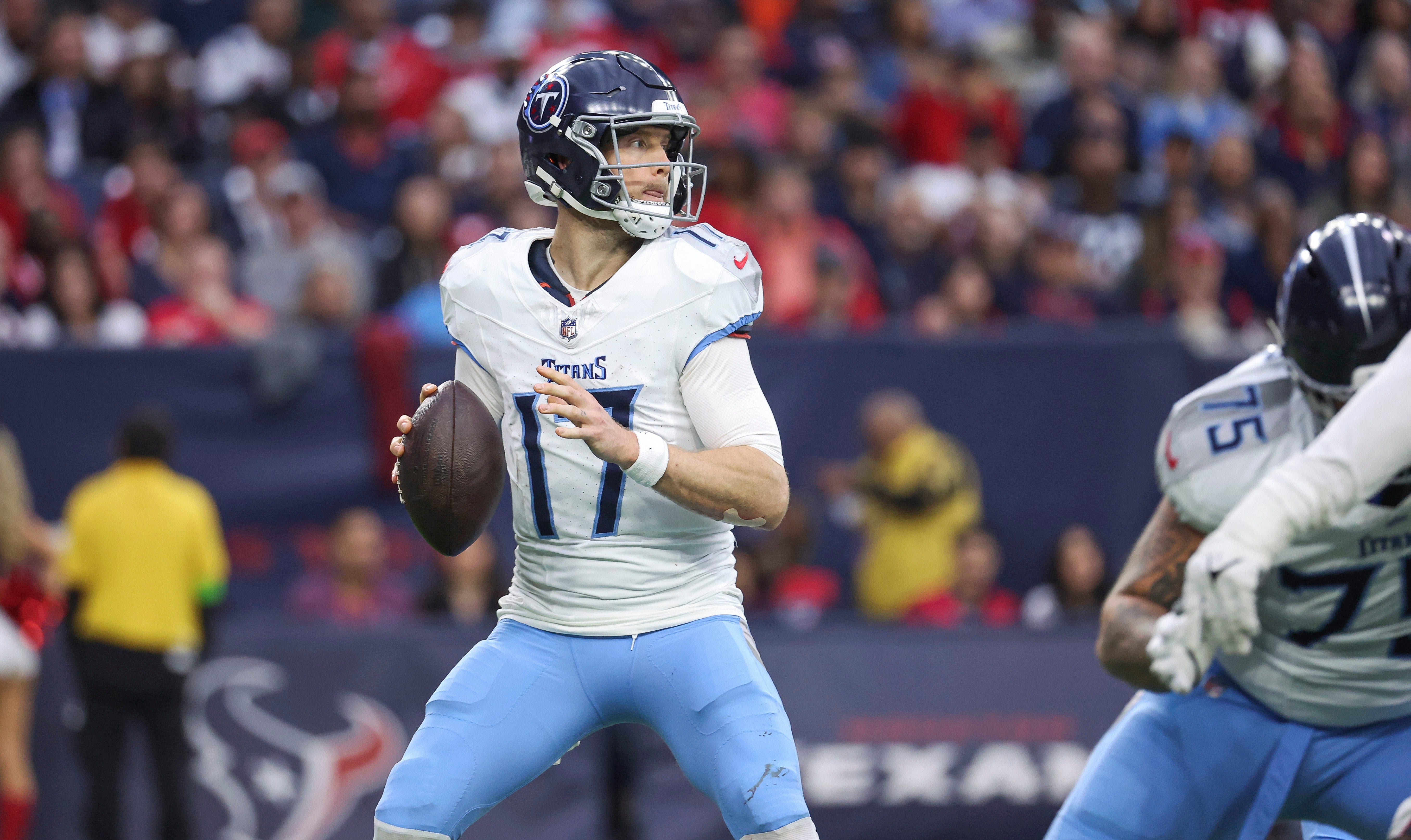 Dec 31, 2023; Houston, Texas, USA; Tennessee Titans quarterback Ryan Tannehill (17) looks for an open receiver during the fourth quarter against the Houston Texans at NRG Stadium.