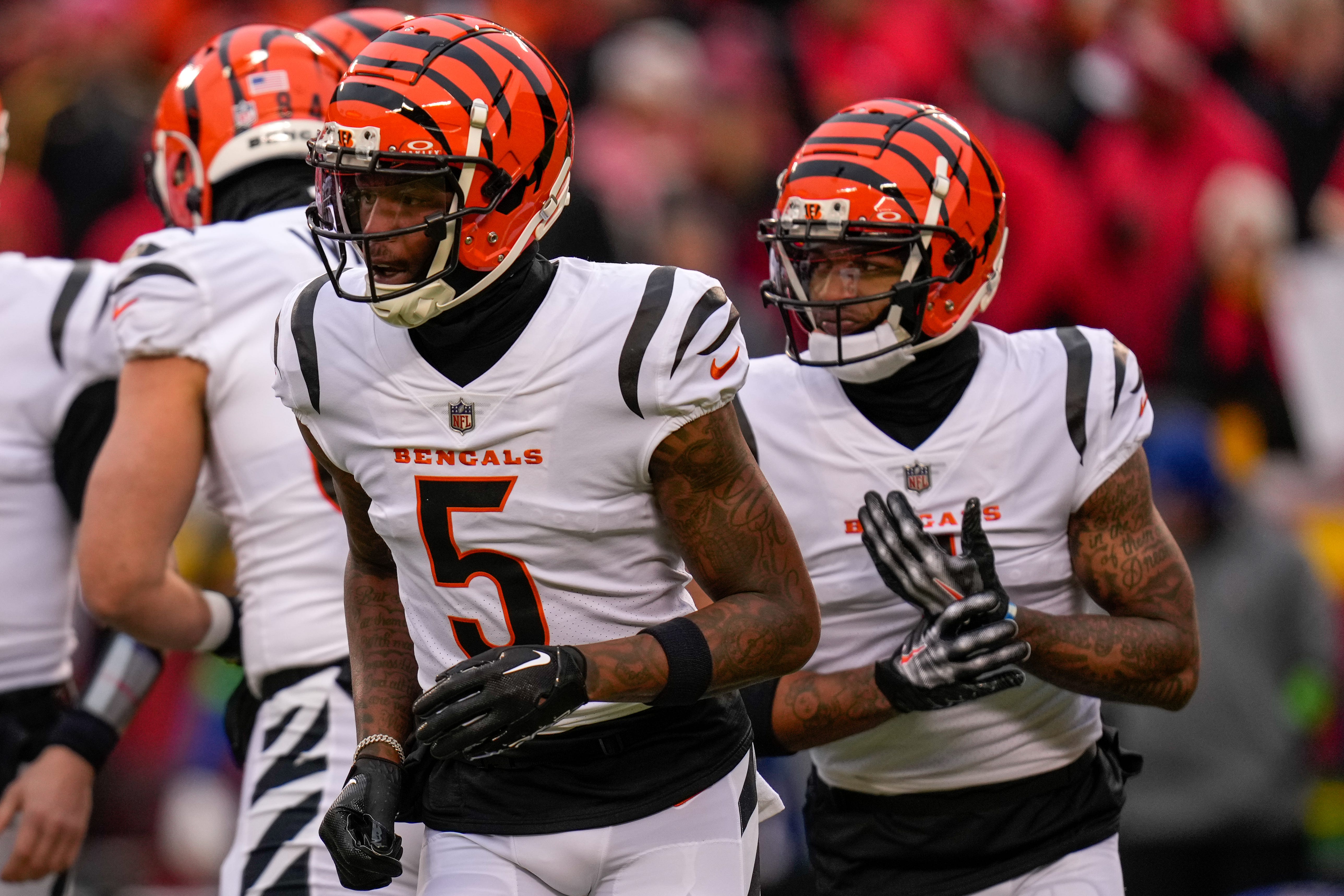 Cincinnati Bengals wide receiver Tee Higgins (5) and wide receiver Ja'Marr Chase (1) run to the outside for a plat in the first quarter of the NFL Week 17 game between the Kansas City Chiefs and the Cincinnati Bengals at Arrowhead Stadium in Kansas City, Mo., on Sunday, Dec. 31, 2023.