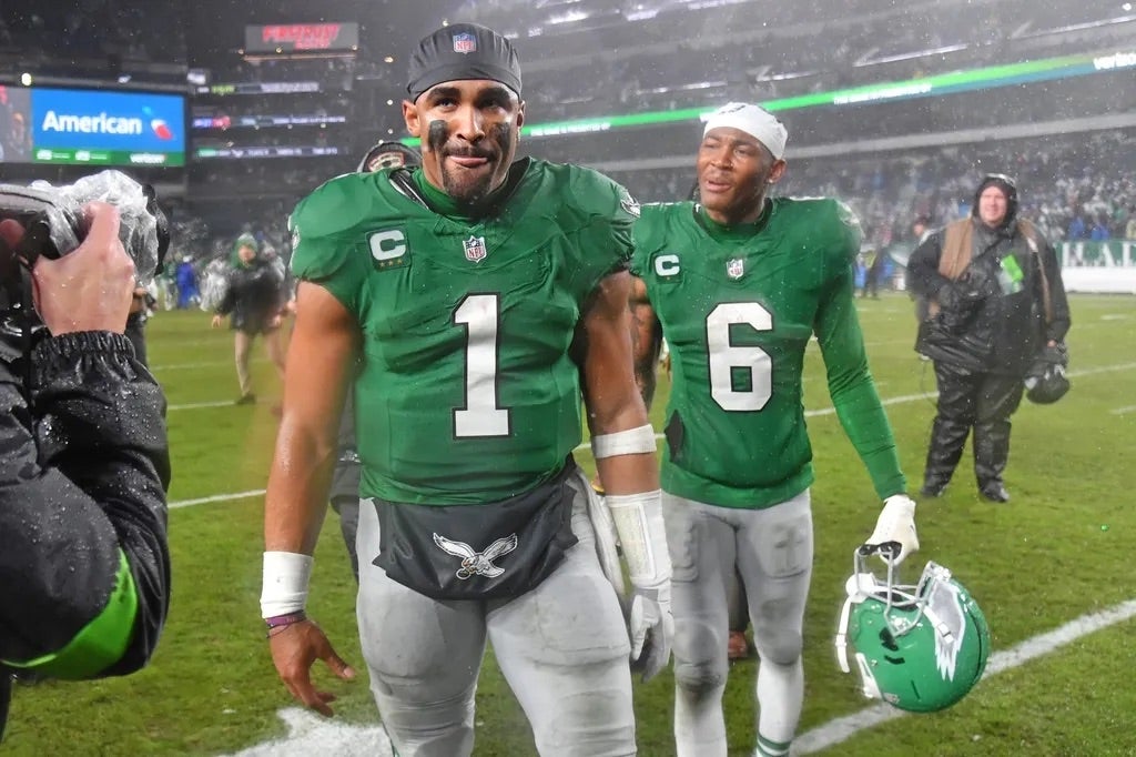 Philadelphia Eagles quarterback Jalen Hurts (1) snd wide receiver DeVonta Smith (6) walk off the field after overtime win against the Buffalo Bills at Lincoln Financial Field.