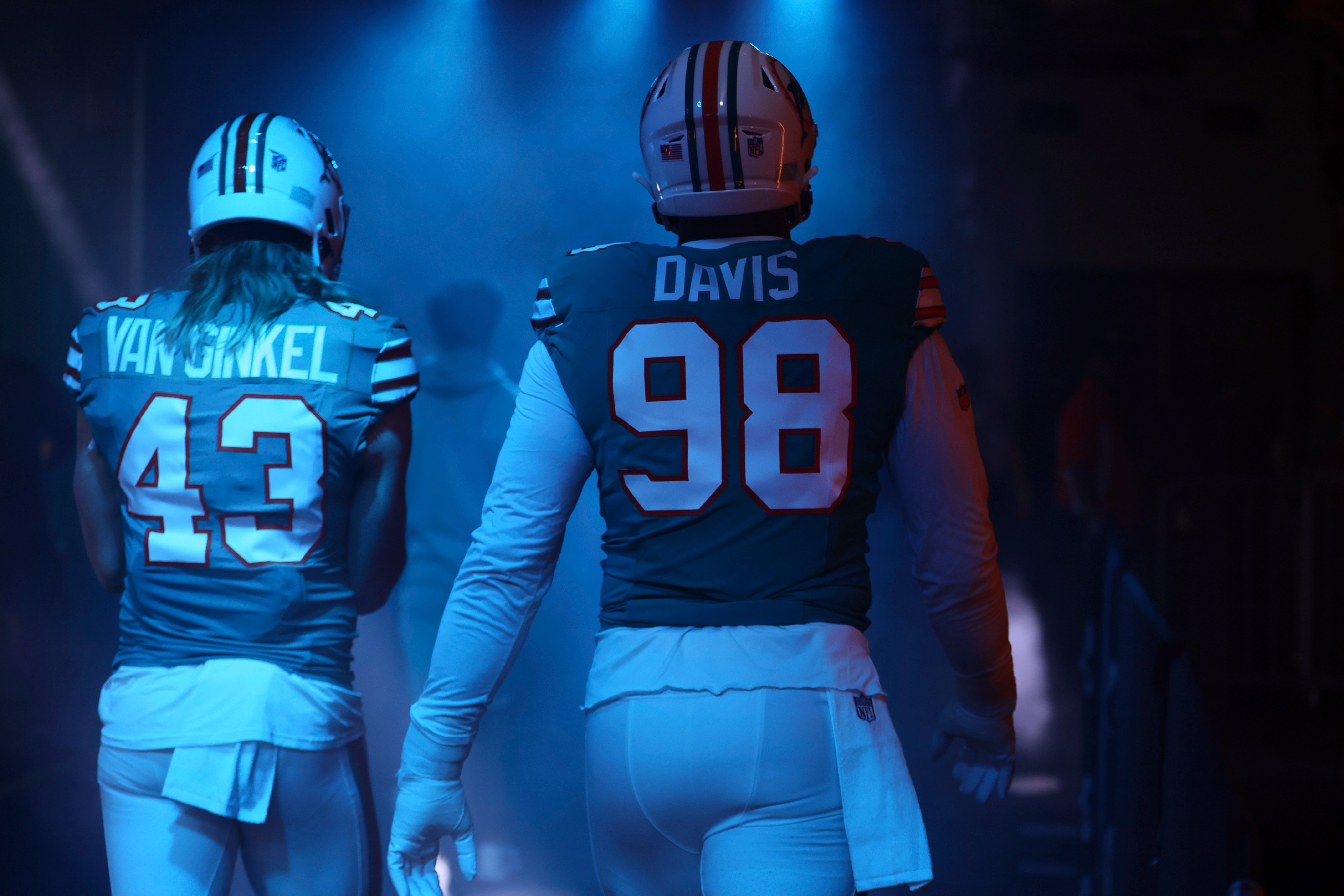Dec 24, 2023; Miami Gardens, Florida, USA; Miami Dolphins defensive tackle Raekwon Davis (98) and linebacker Andrew Van Ginkel (43) walk toward the field prior to the game against the Dallas Cowboys at Hard Rock Stadium.