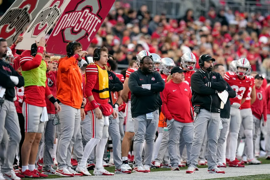 Ohio State Buckeyes head coach Ryan Day and running backs coach Tony Alford watch from the sideline during the NCAA football game against the Minnesota Golden Gophers at Ohio Stadium